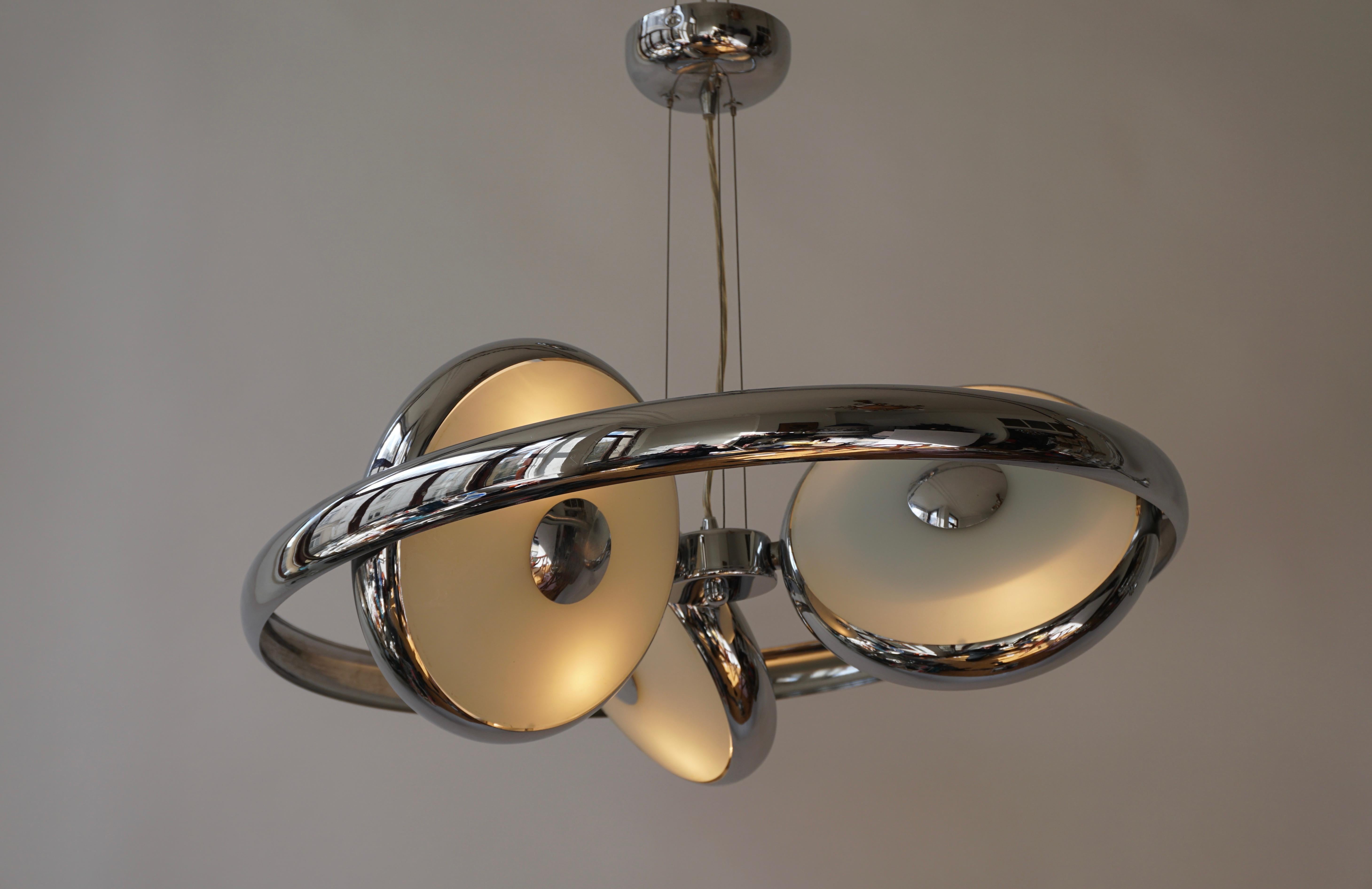 One large adjustable ufo chandeliers in glass and chrome.
Takes six E 14 size bulbs, up to 40 watts each for 240 watts total. 

Two pieces have been sold and one is still available.

Measures: Diameter 58 cm.
Height fixture 9 cm.
Total height 125 cm.