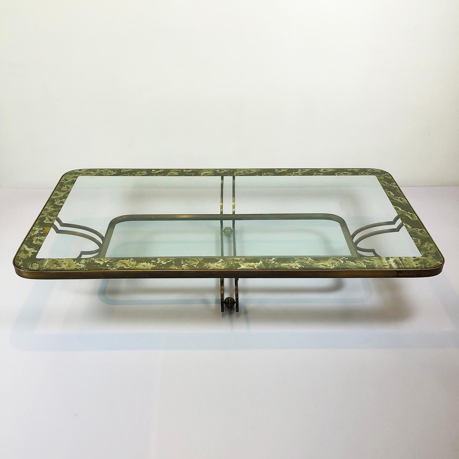 We offer these set of bronze side tables and center table designed by Arturo Pani circa 1950s, the designer used patinated bronze in contrast with glass and antiqued églomisé mirror for these creations.