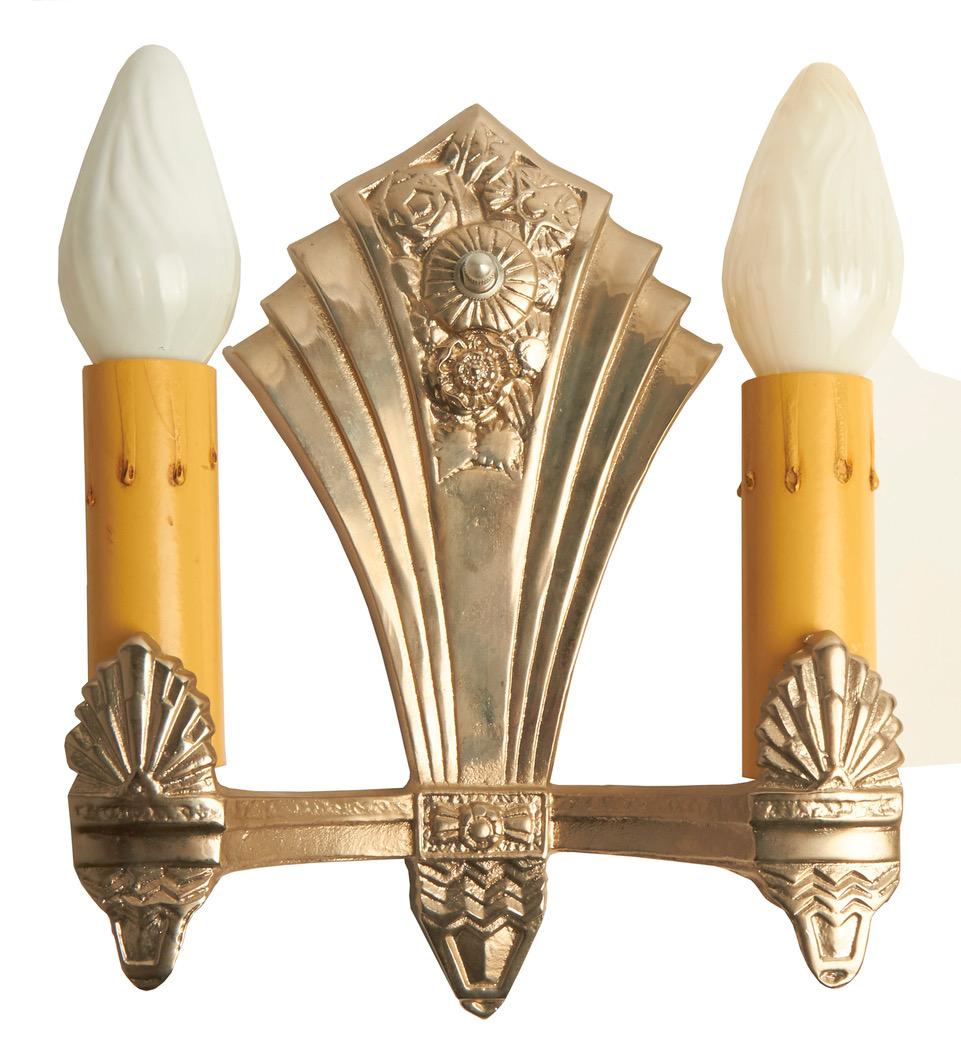This beautiful set of three American Art Deco chrome fan-shaped, geometric twin candle-form wall sconces have been meticulously re-chromed and re-wired by the previous owner. They display beautifully and ready to install. (The bulbs shown are for