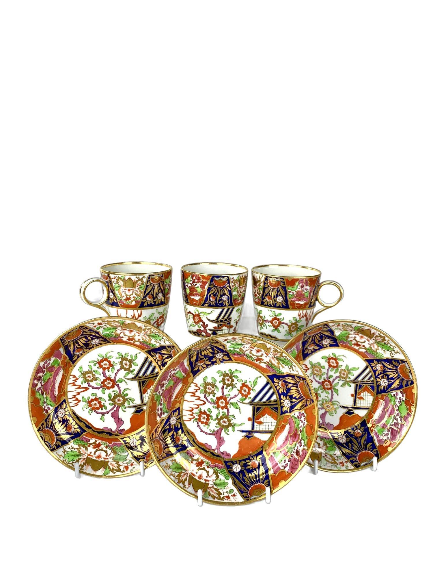 This gorgeous set of three antique English porcelain coffee cups with matching saucers was hand-painted by Chamberlains Worcester circa 1805.
It is a beautiful example of George III era design.
Each piece is meticulously hand-painted in a bold