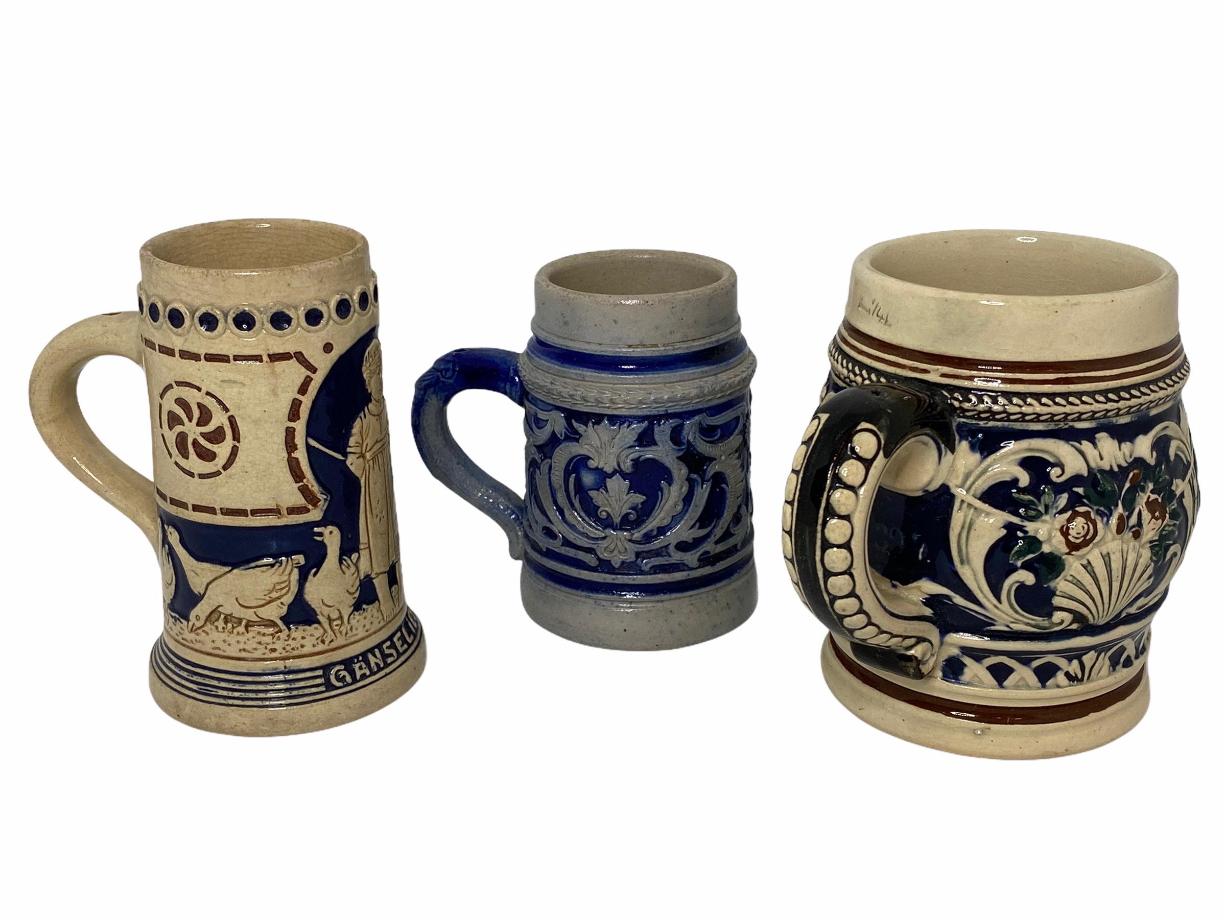 A lot of three german beer steins. Each made in Germany circa 1900s or older. Absolutely gorgeous pieces still in great condition, without damage. One is a 1/4 Liter Stein and two of them are approx. for 1/8 Liter. The one with the Goose Maid is