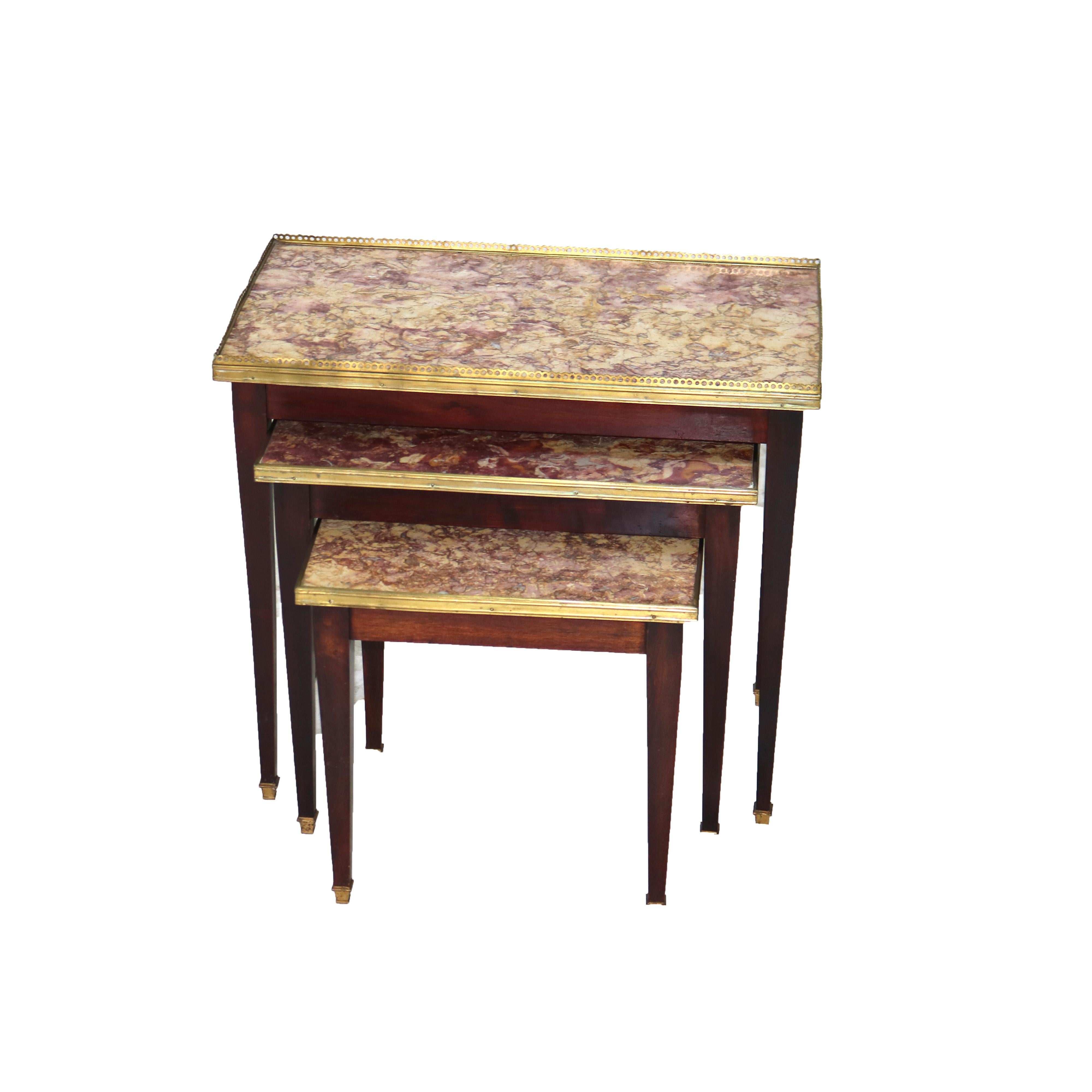 ***Reduced In-House Delivery Rates - Click on “Ask Seller” to Request a Quote***

Set of Three Antique Mahogany Rouge Marble Top Nesting Tables with Bronze Trim C1920

Measures - 
Smaller 16