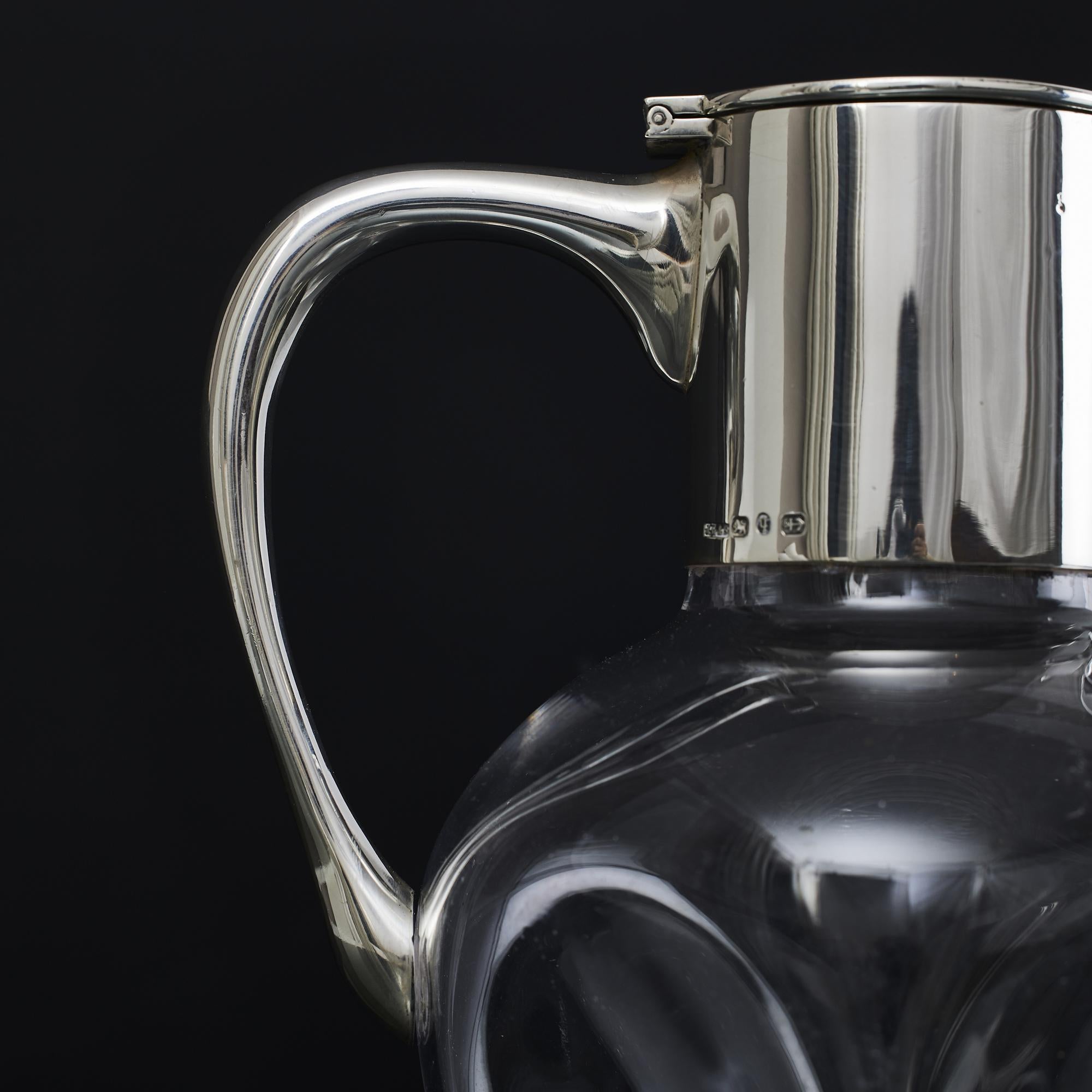 Sterling Silver Pinched glass wine jug with silver mounts For Sale