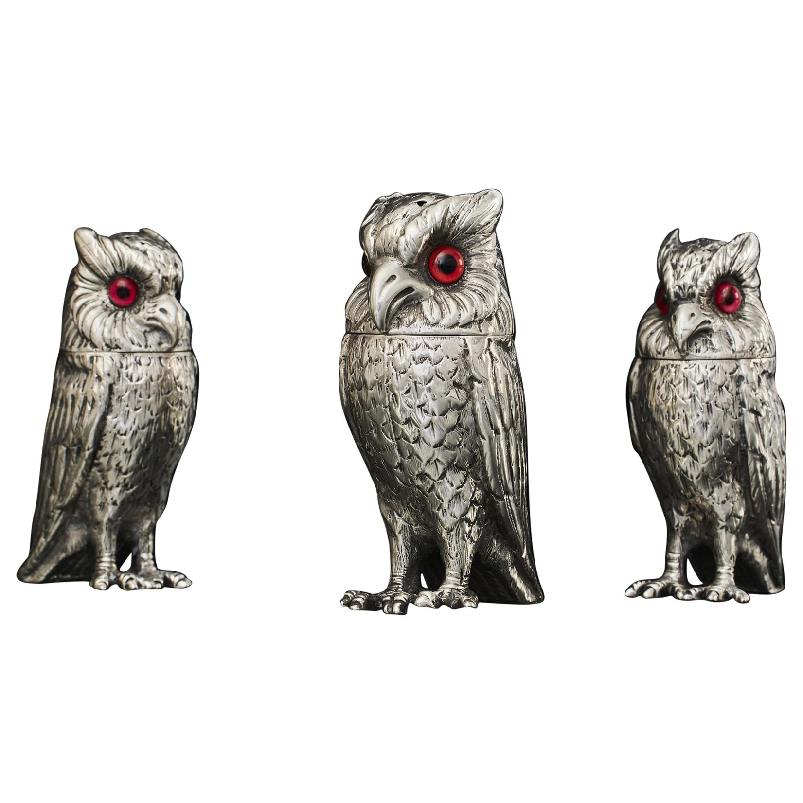 Set of three antique silver owl pepper casters