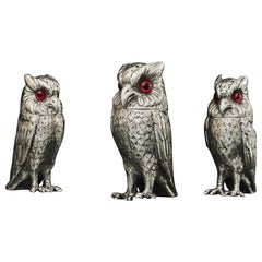 Set of three antique silver owl pepper casters