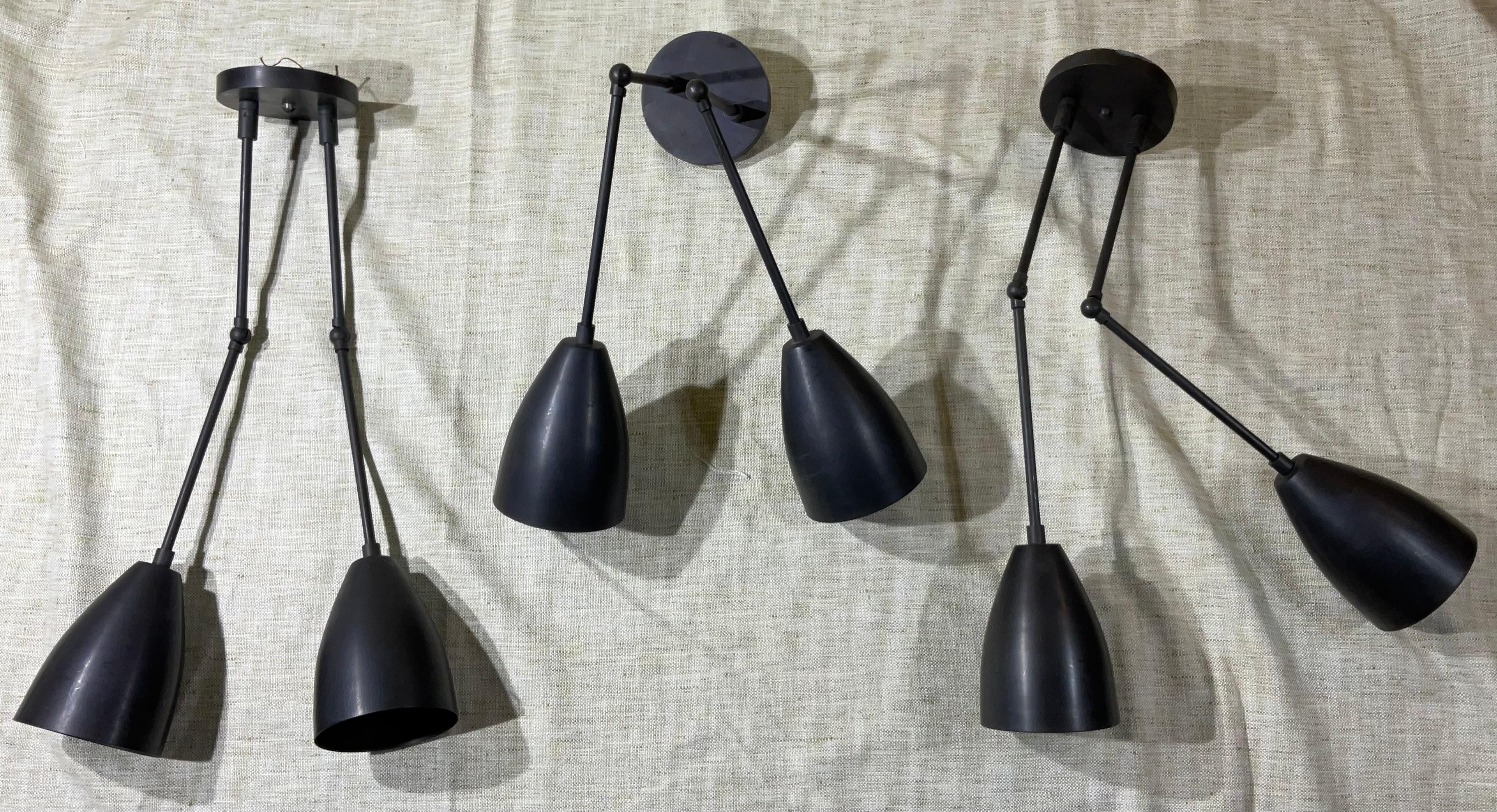 Elegant set of three Apparatus wall sconces , made of solid brass . each sconce made of two arm lights that can rotate, with 60/watt each socket.
Backplate size 5”
Use for dry locations only 