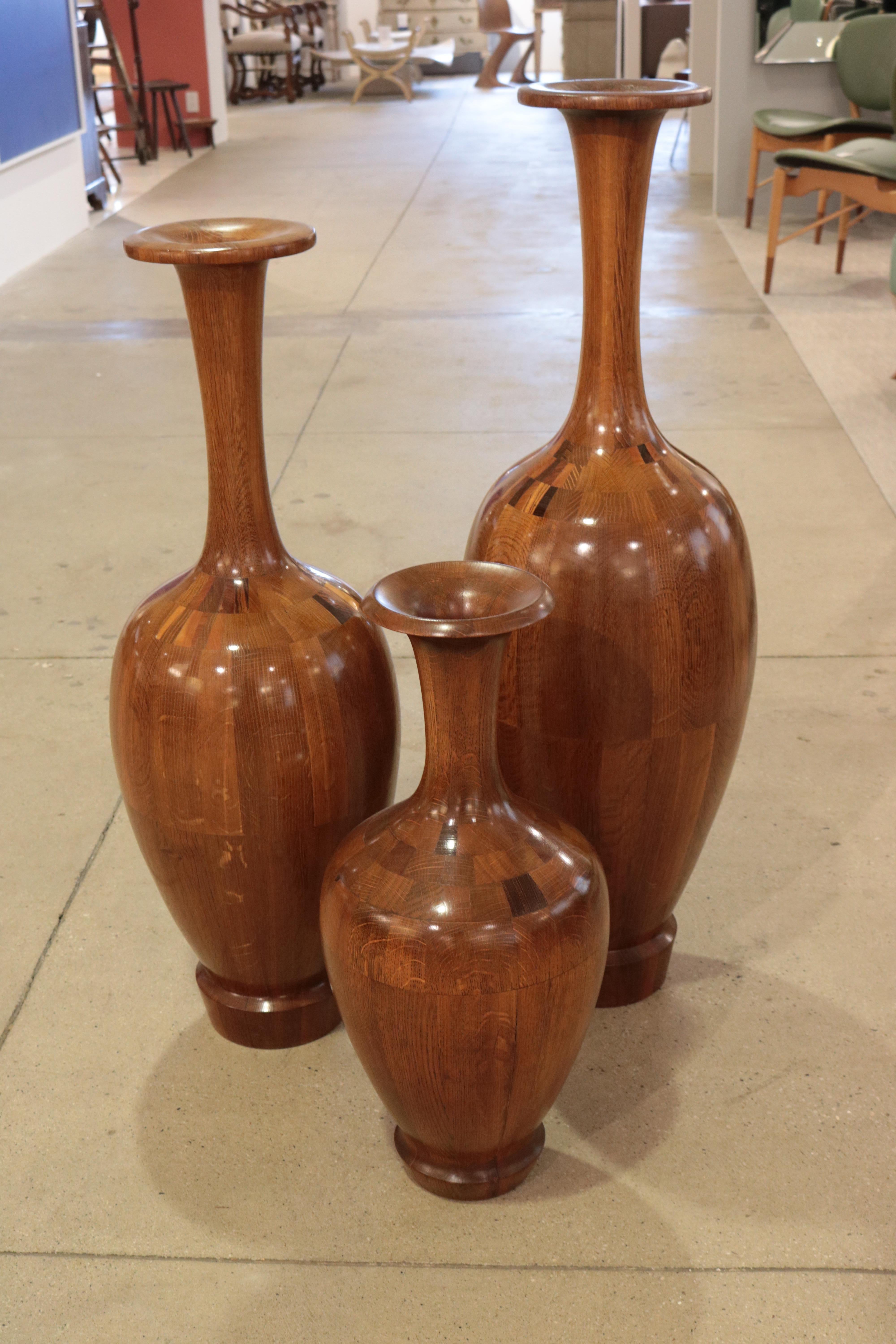 A fine set of three Art Deco decorative vases.
Various woods.
