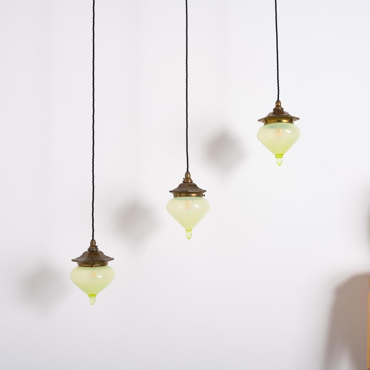 Arts and Crafts Set of Three Arts & Crafts Vaseline Glass Teardrop Shades with Aged Brass Galler