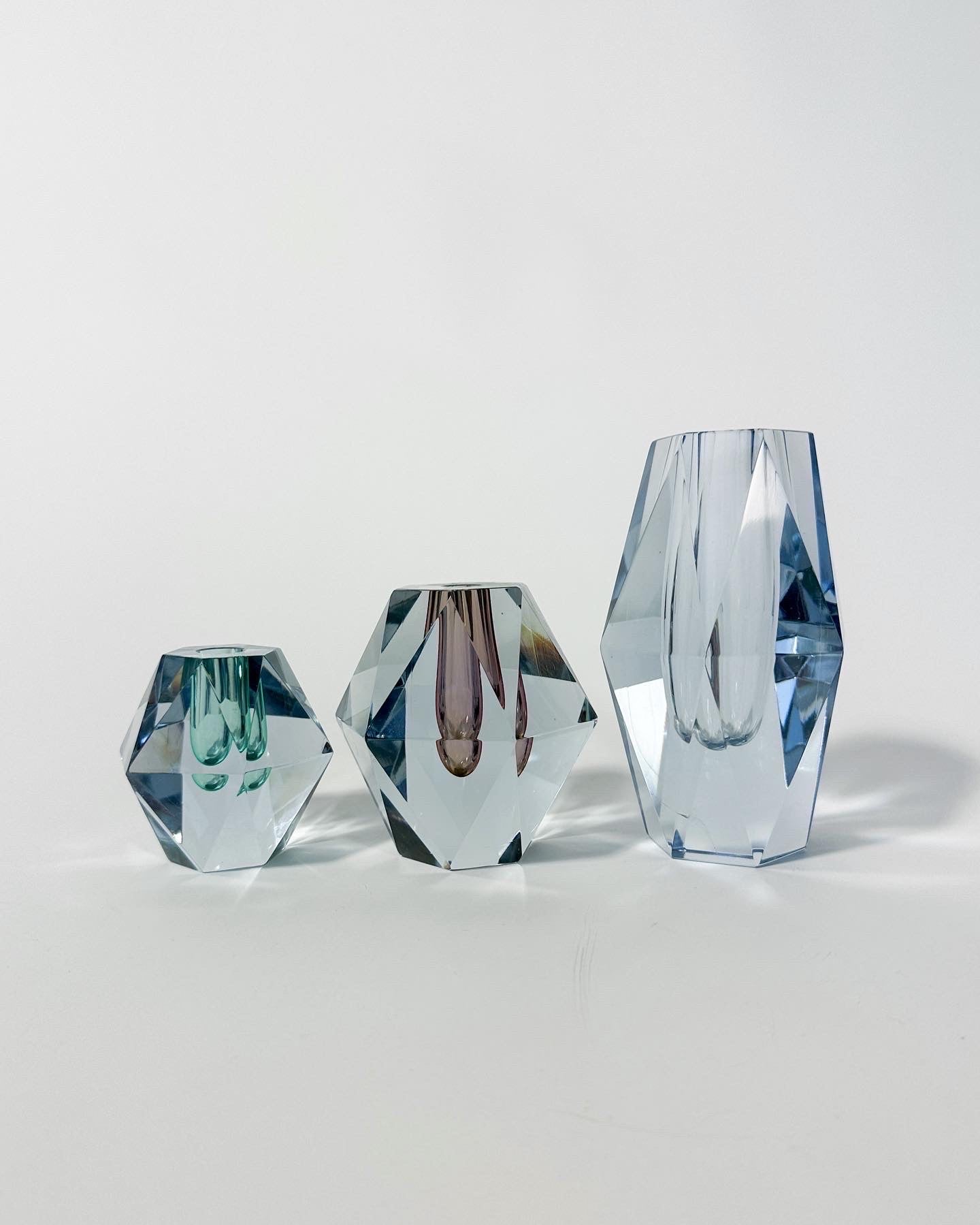Set of three Asta Strömberg diamond crystal vases for Strömbergshyttan, Sweden, 1960s.

All in very good condition with minimal wear, all signed underneath.

Model B950, clear glass, height: 16.5 cm

Model B970, amethyst glass, height: 10 cm

Model
