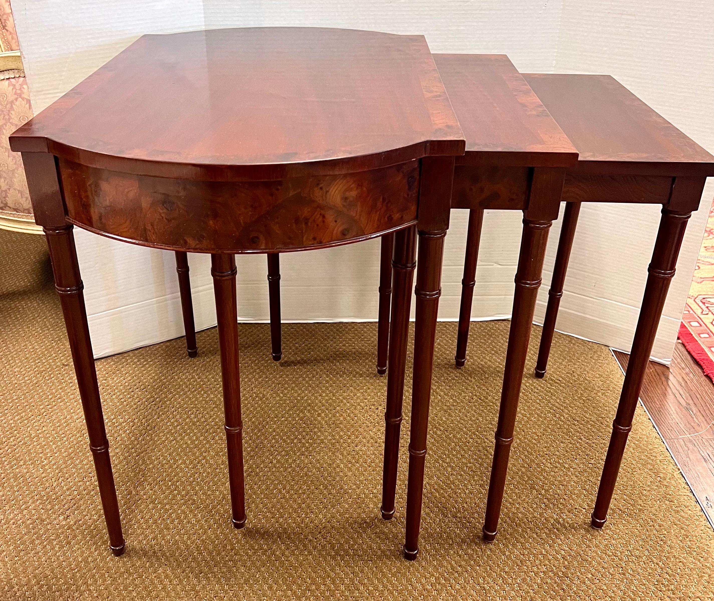 Set of 3 Baker Mahogany Nesting Tables crafted from rich mahogany wood, these tables exude sophistication and elegance. The nesting design offers versatility and space-saving convenience, allowing you to effortlessly expand your surface area when