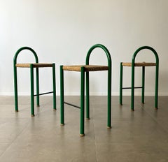Set of three bar stools in green metal and rush seats, 1970’s Italy