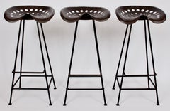 Set of Three Benjamin Baldwin Stye Tractor Seat Swivel Bar Stools, 1950s