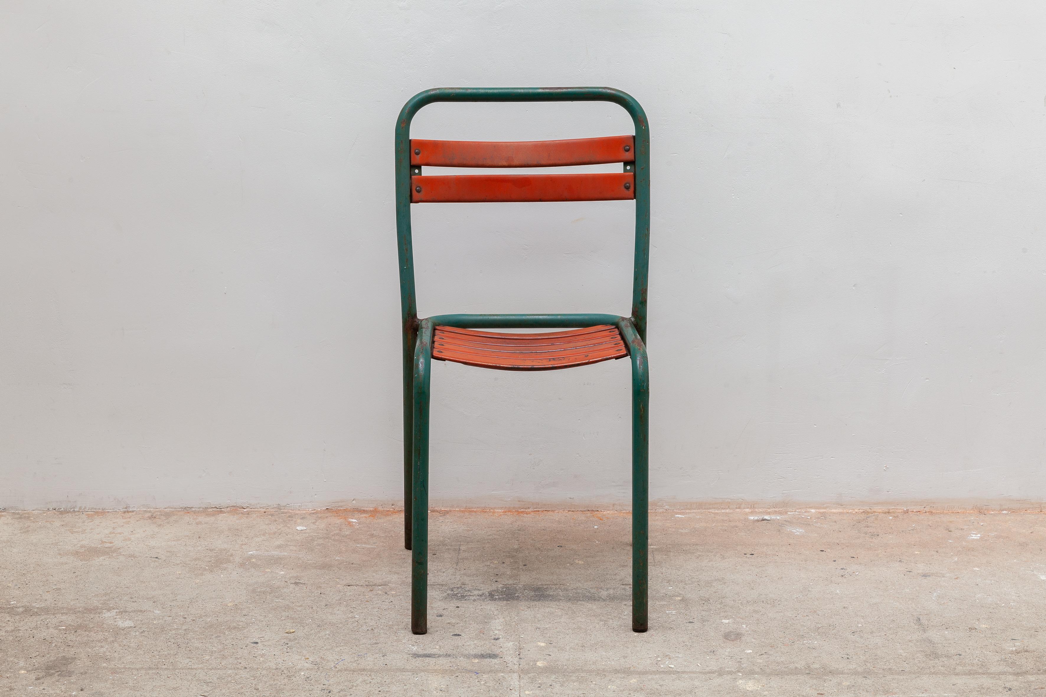 Vintage industrial chairs. Tubular green metal frame with orange slatted seat accents. Great for cafe or outdoor seating. Dimensions: 42W x 80H x 42D cm, Seat: 42 cm high.