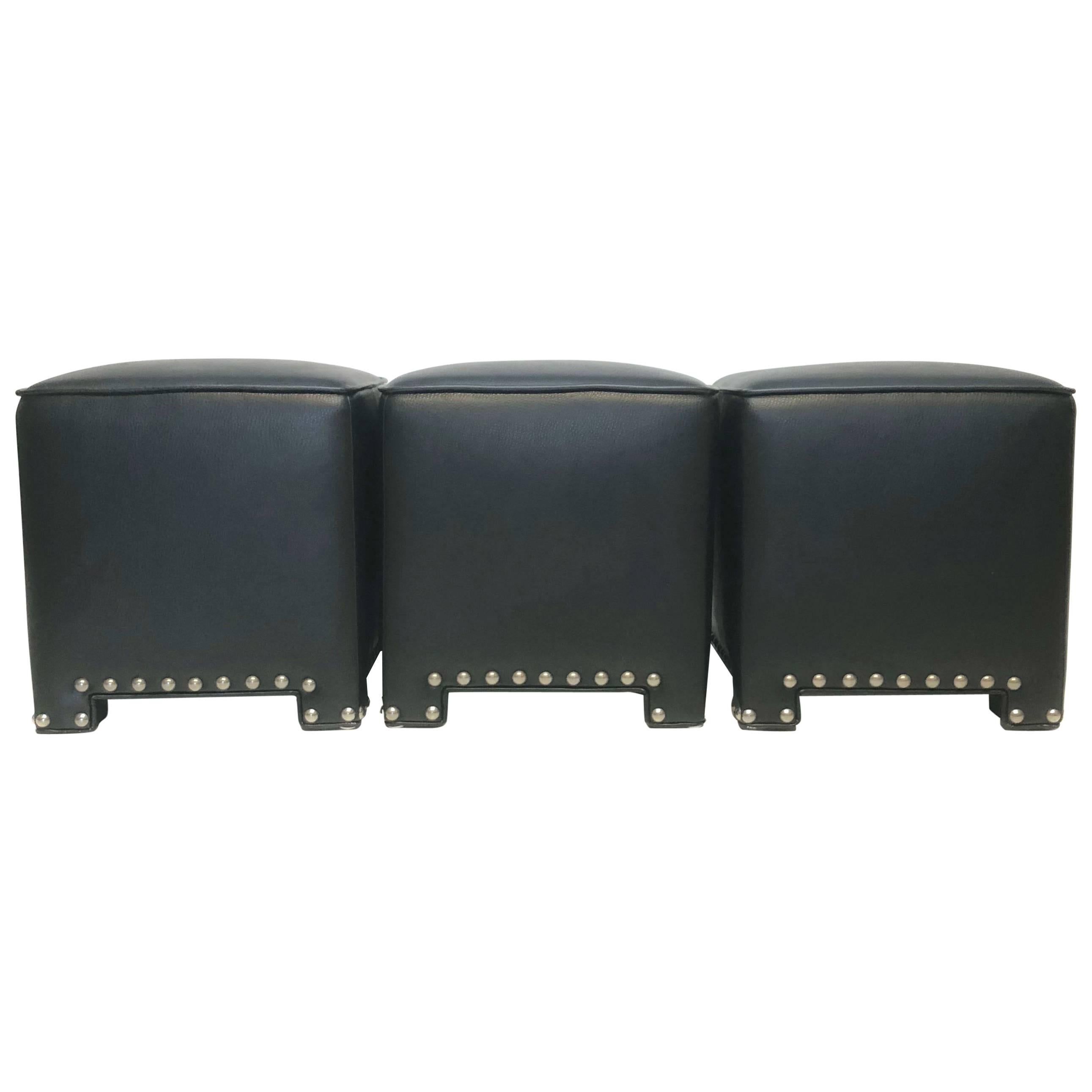 Set of Three Black Faux Leather Ottomans For Sale