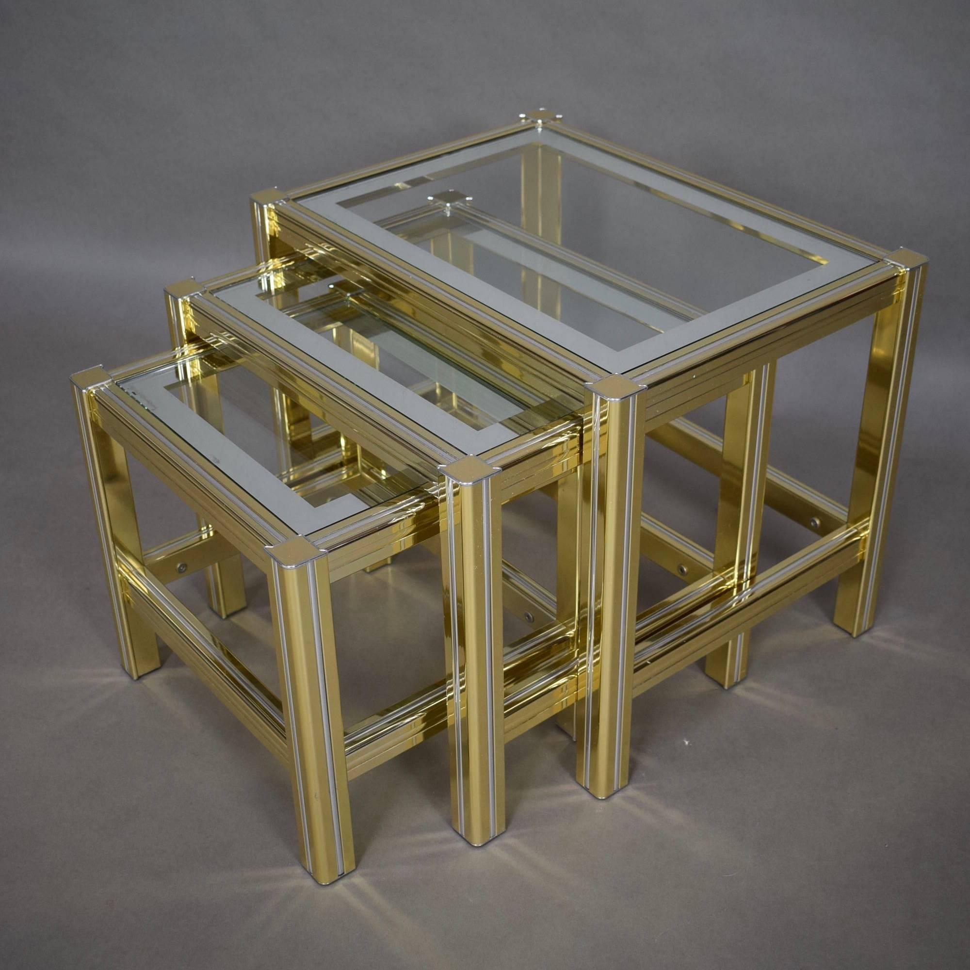 Set of three 1970s nesting tables in brass and (mirror) glass.

Designer: Willy Rizzo / Pierre Vandel style

Manufacturer: Unknown

Country: Belgium, Italy or France

Model: Nesting tables

Designed in: 1970s

Date of manufacturing: