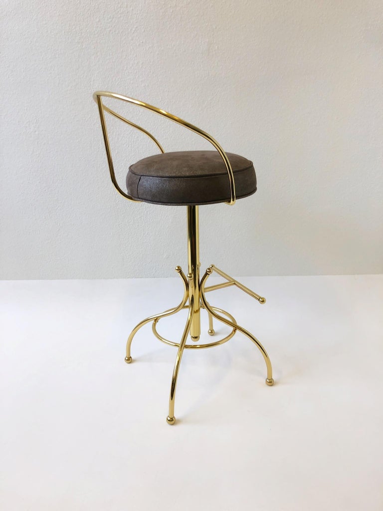 Mid-20th Century Set of Three Brass and Suede Leather Swivel Barstools by Charles Hollis Jones For Sale