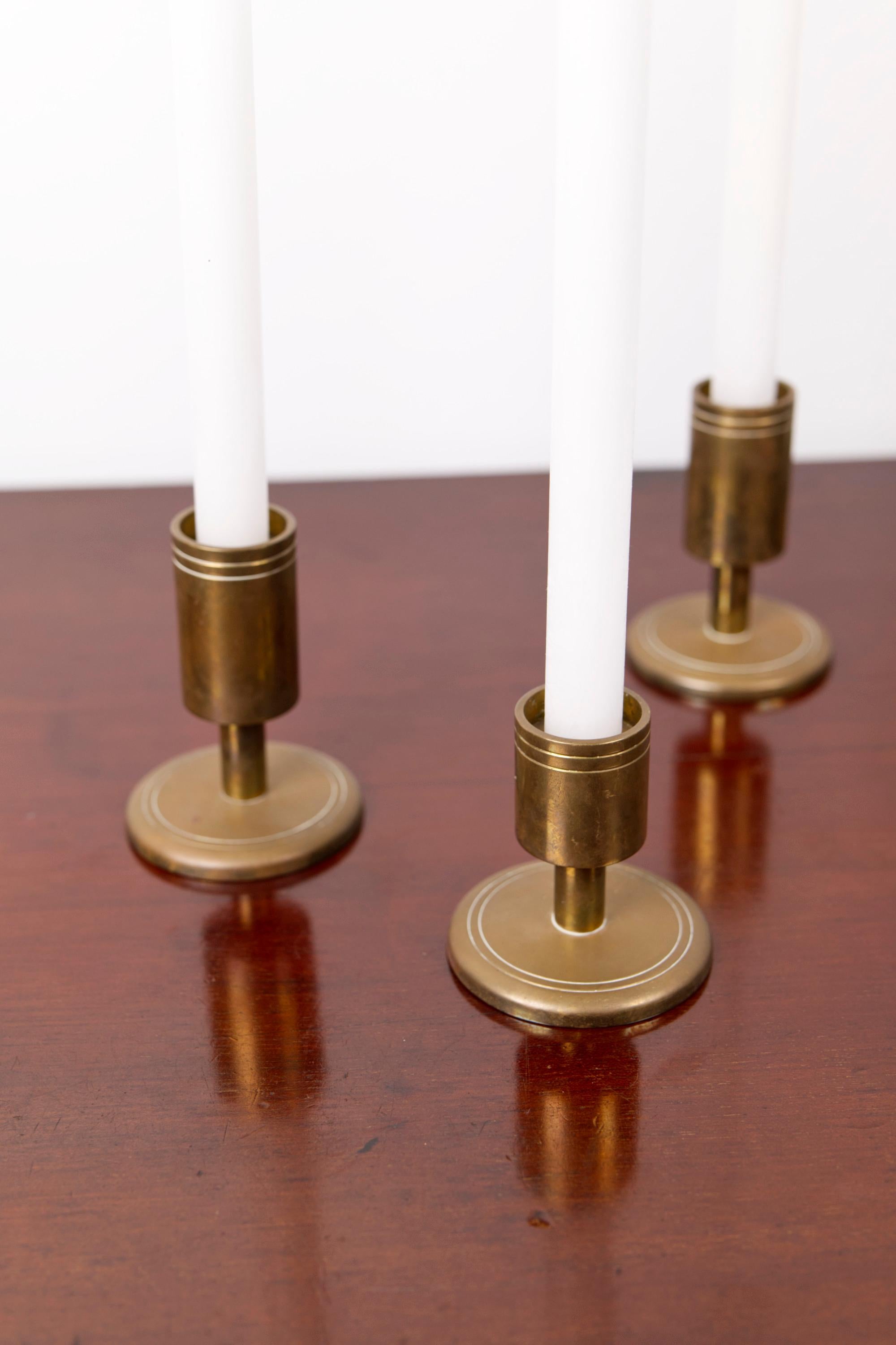 Danish Set of three brass candle holders by Dantorp, Denmark, 1960's For Sale