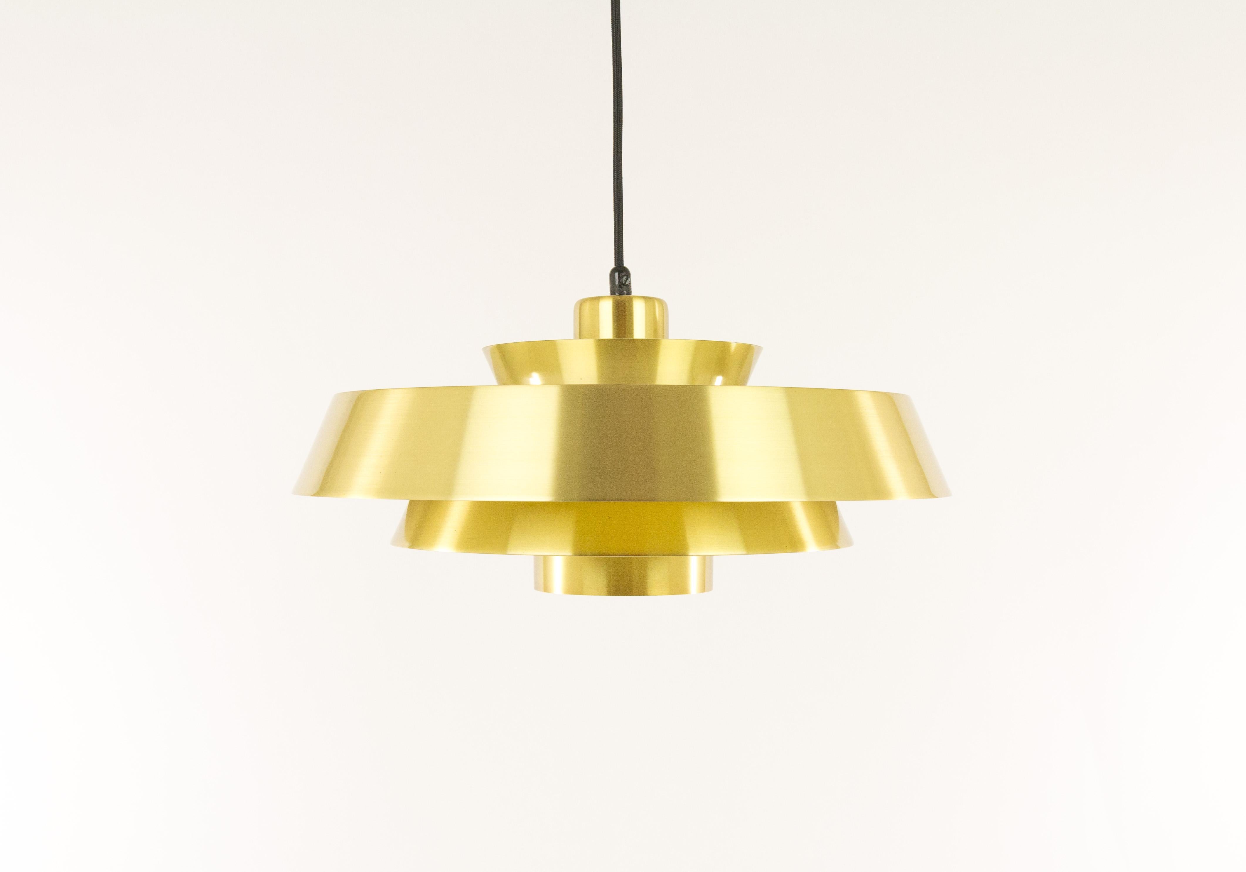 Pendant, model Nova, designed in the 1960s by Jo Hammerborg, main designer of Danish lighting manufacturer Fog & Mørup in the 1960s and 1970s.

This model was produced in three different metals: copper, brass and aluminium. This is the brass