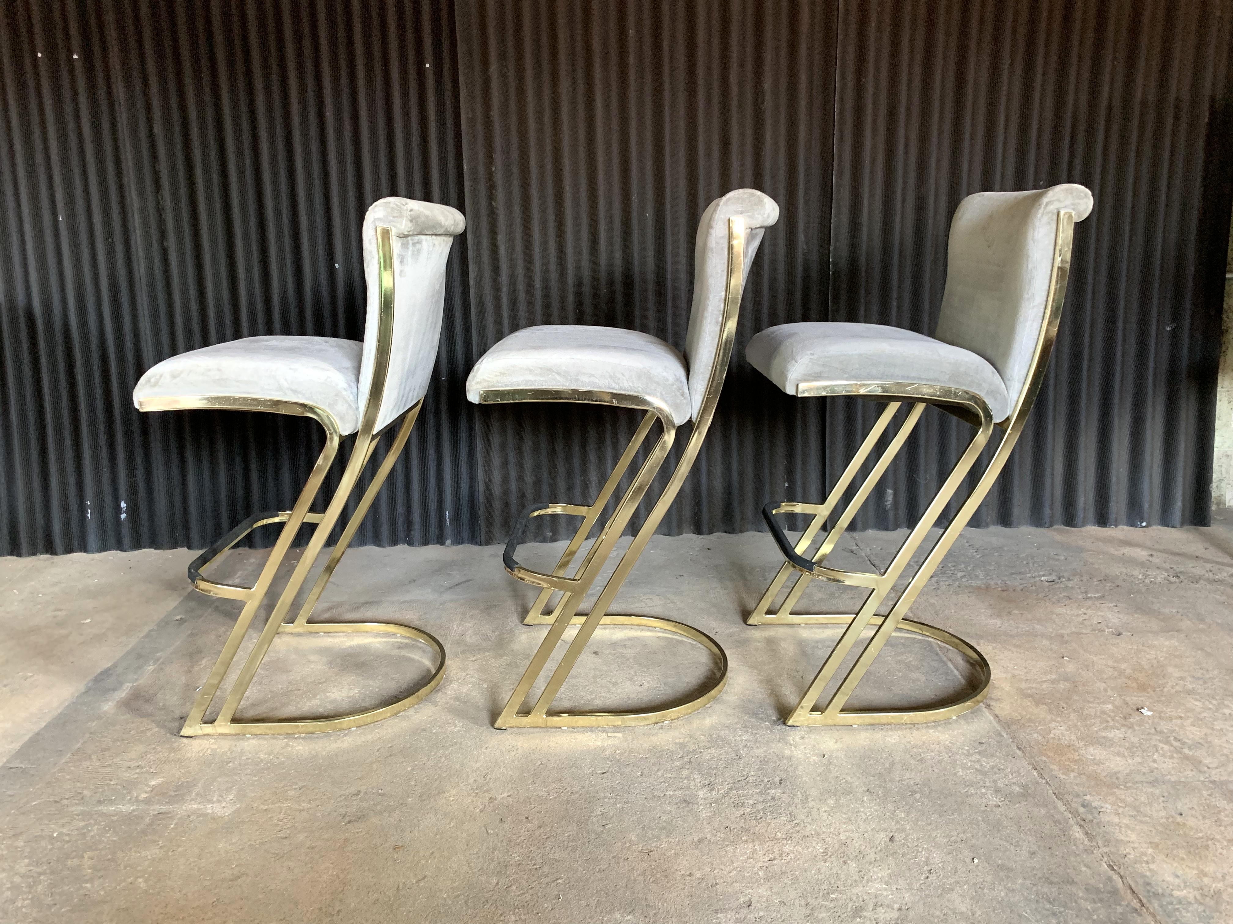 Fun trio of brass stools in the style of Pierre Cardin.
Brass is in great condition with only minor scratches. No pitting.
Just had the fabric professionally cleaned yet these would be perfect for recovering.
One wear mark/hole as shown.
Sturdy