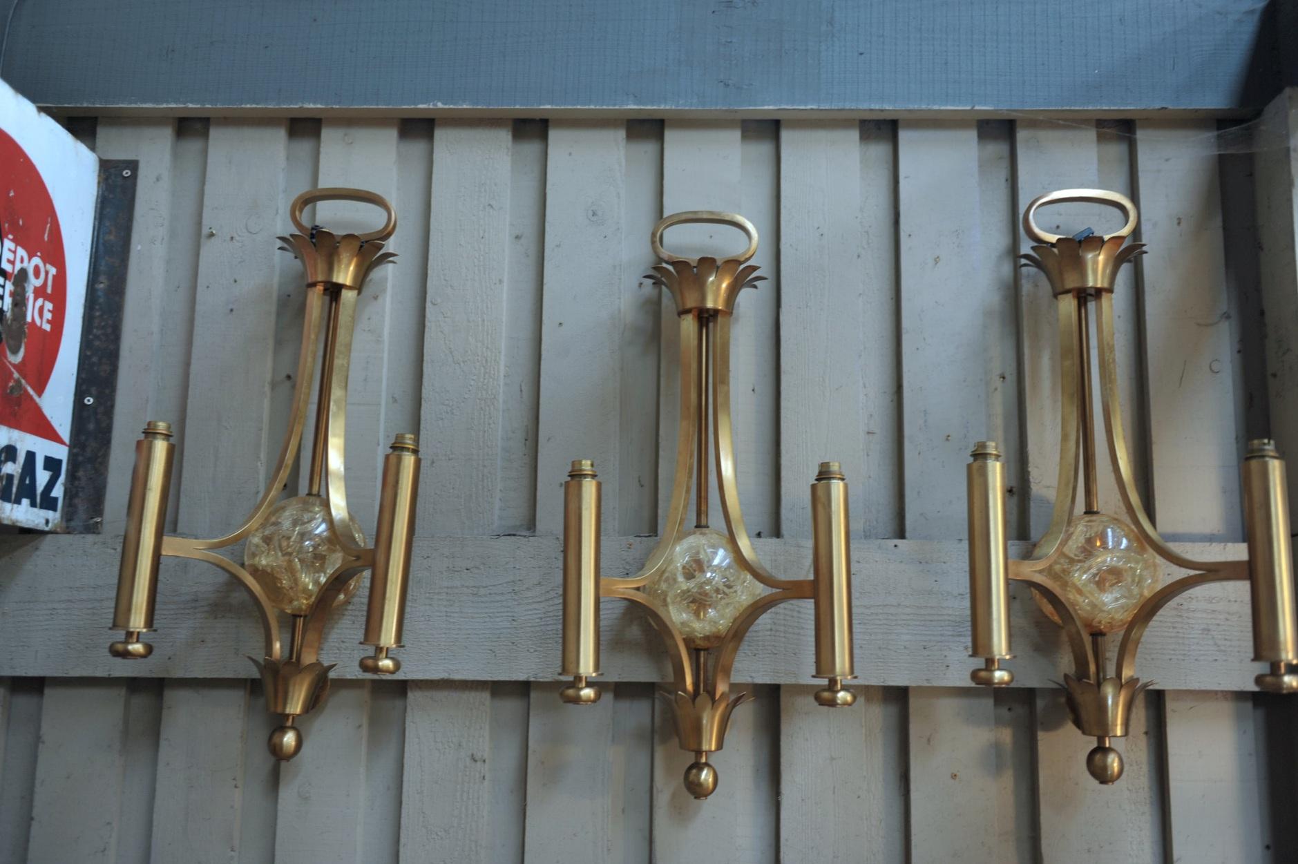 Set of 3 wall sconces in brass with resin center half globe. 3 Kg each.