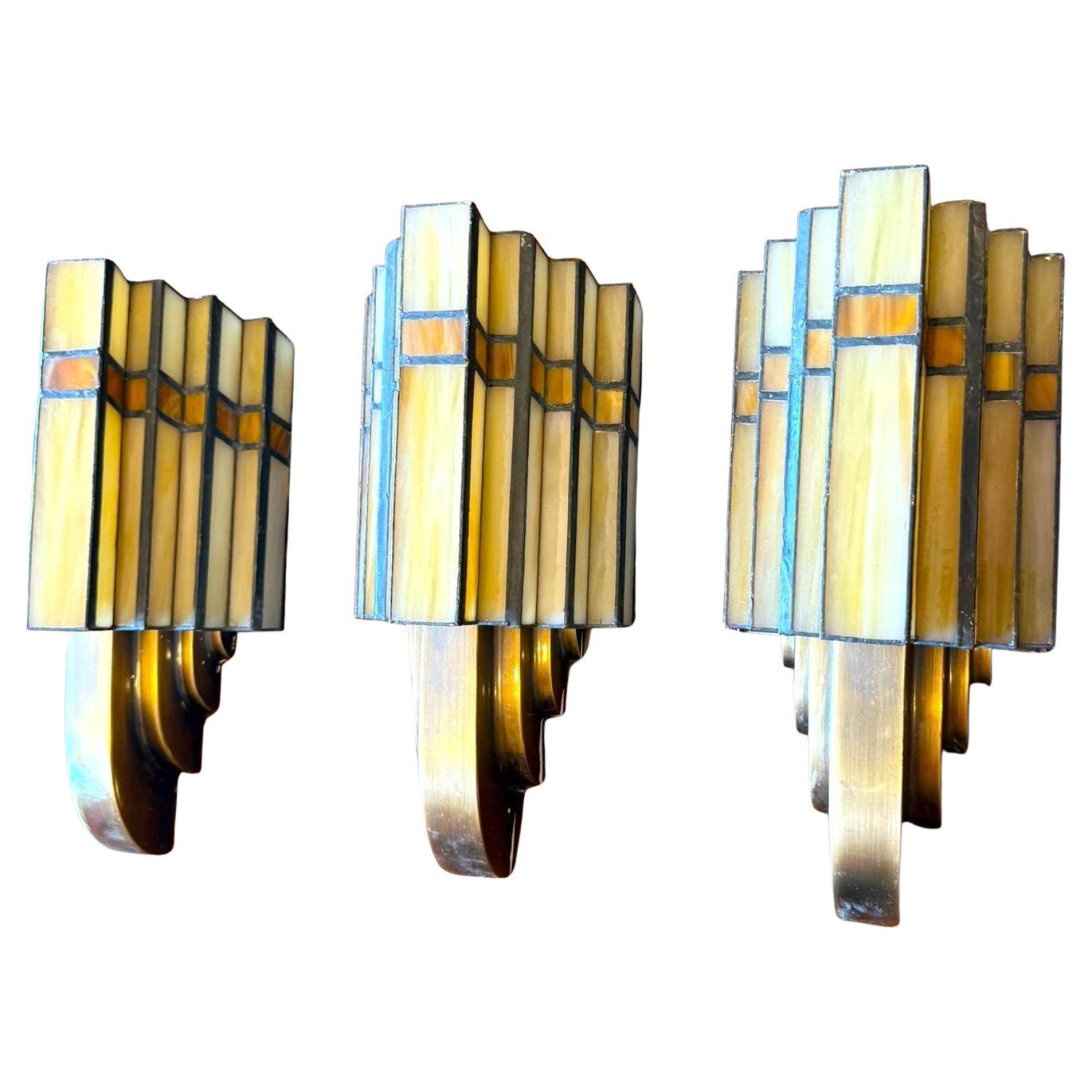 Set of Three Bronze and Opaline Glass Art Deco Sconces
