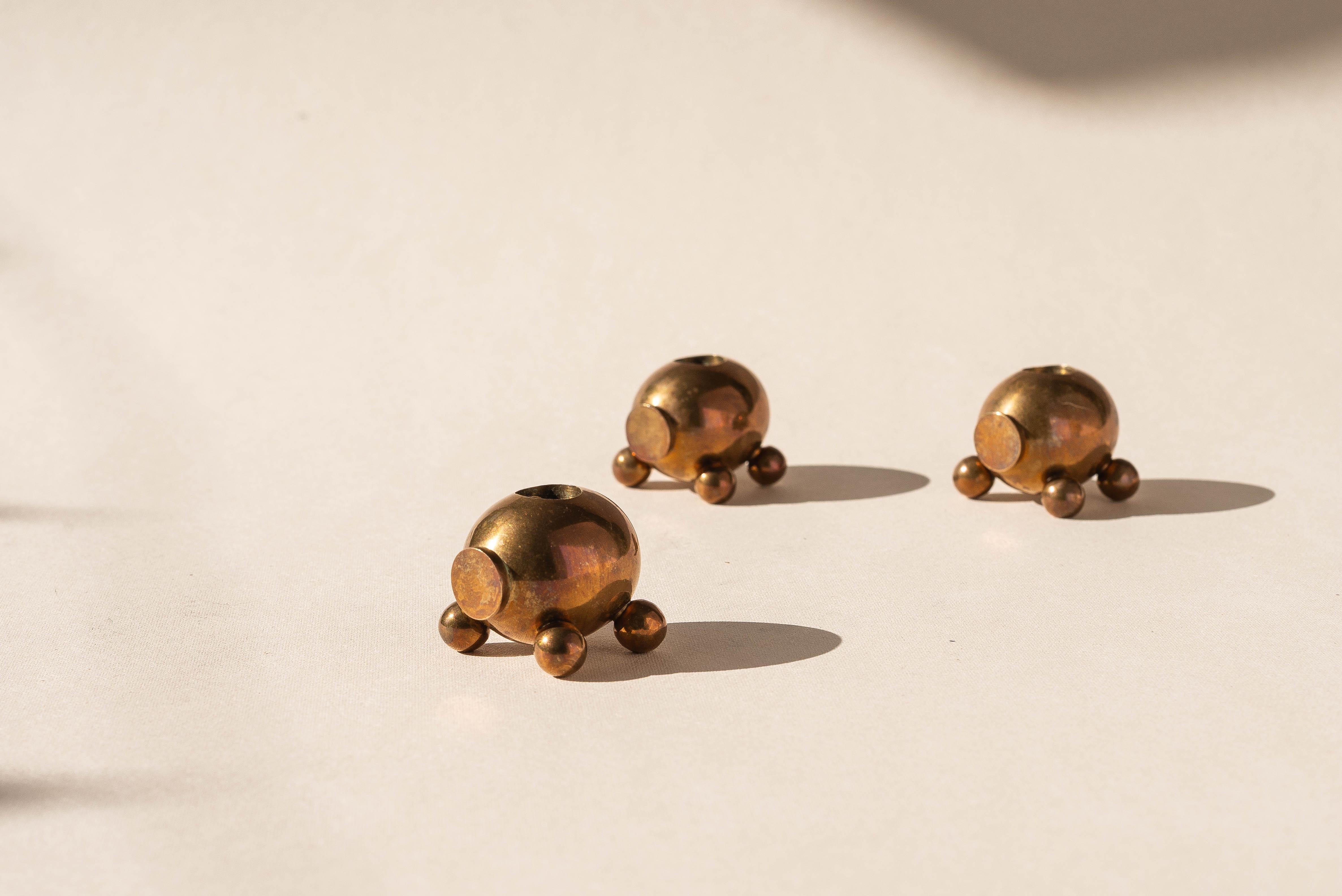 Set of Three Bronze Candlesticks, Morells Gjuteri, Sweden 1970s

Fabricated by Morells Metallgjuteri in Sweden.

Their design makes them look like little animals, rendered in a minimalist, almost Cubist style.

Made of bronze with a brass plated