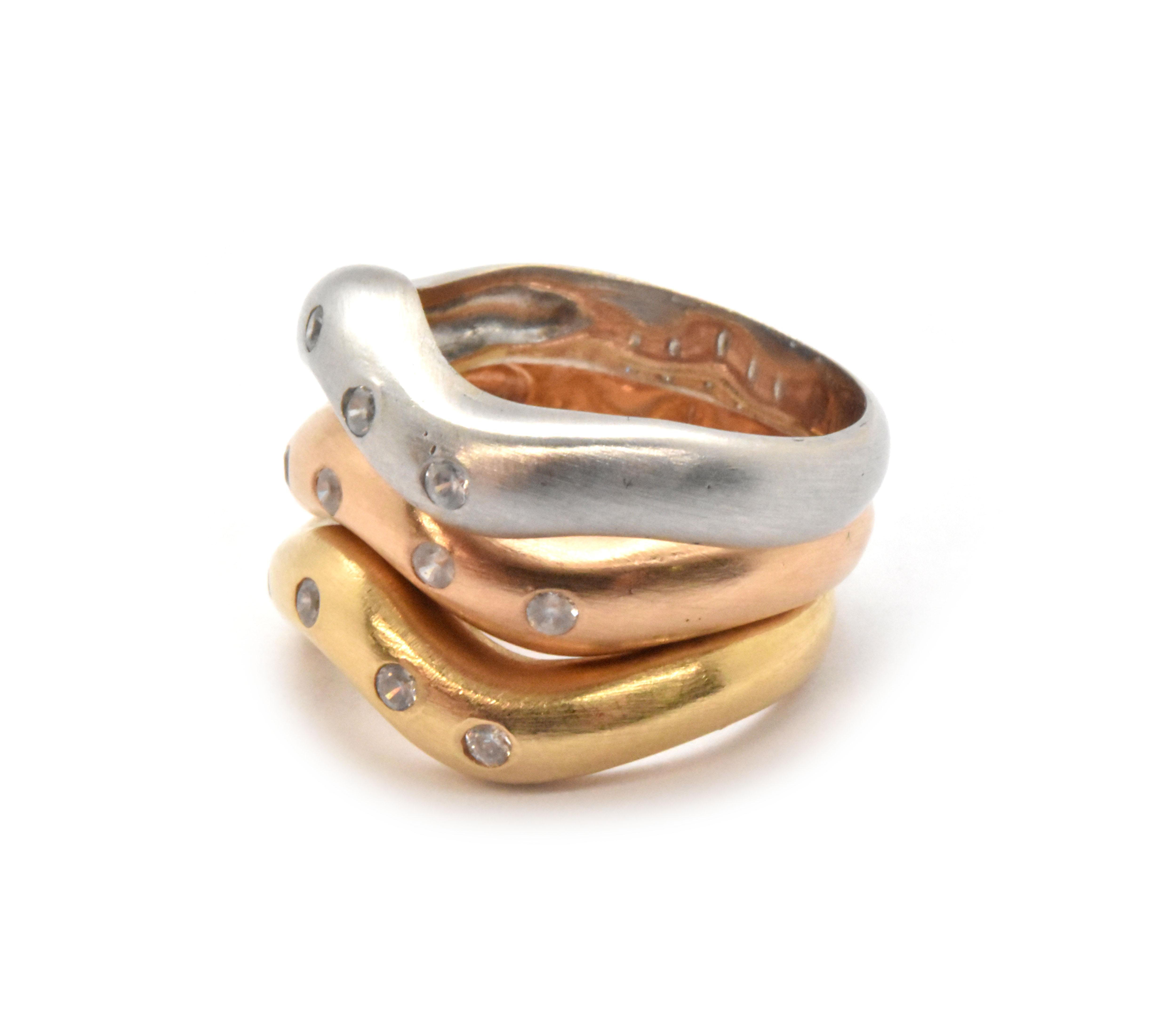This set of rings is gorgeous! There are 3 rings in all, and each is made in 18k gold: white, rose and yellow. There are 5 diamonds in each band, and the stones have a total weight of 0.30ct. The bands measure 4mm wide, and together the bands weigh