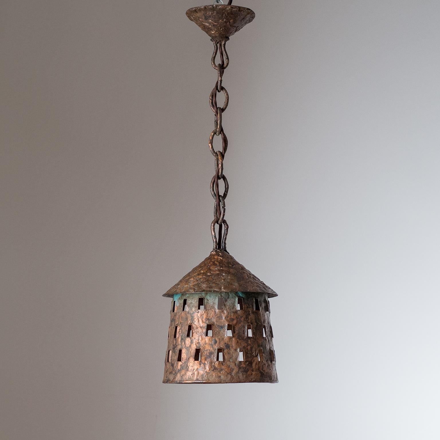Rare primitive or Brutalist copper lanterns/pendants, circa 1970. Very rough and coarse surface with a rich patina. Each light has a new E27 socket with new wiring. Priced and sold as a set of three.