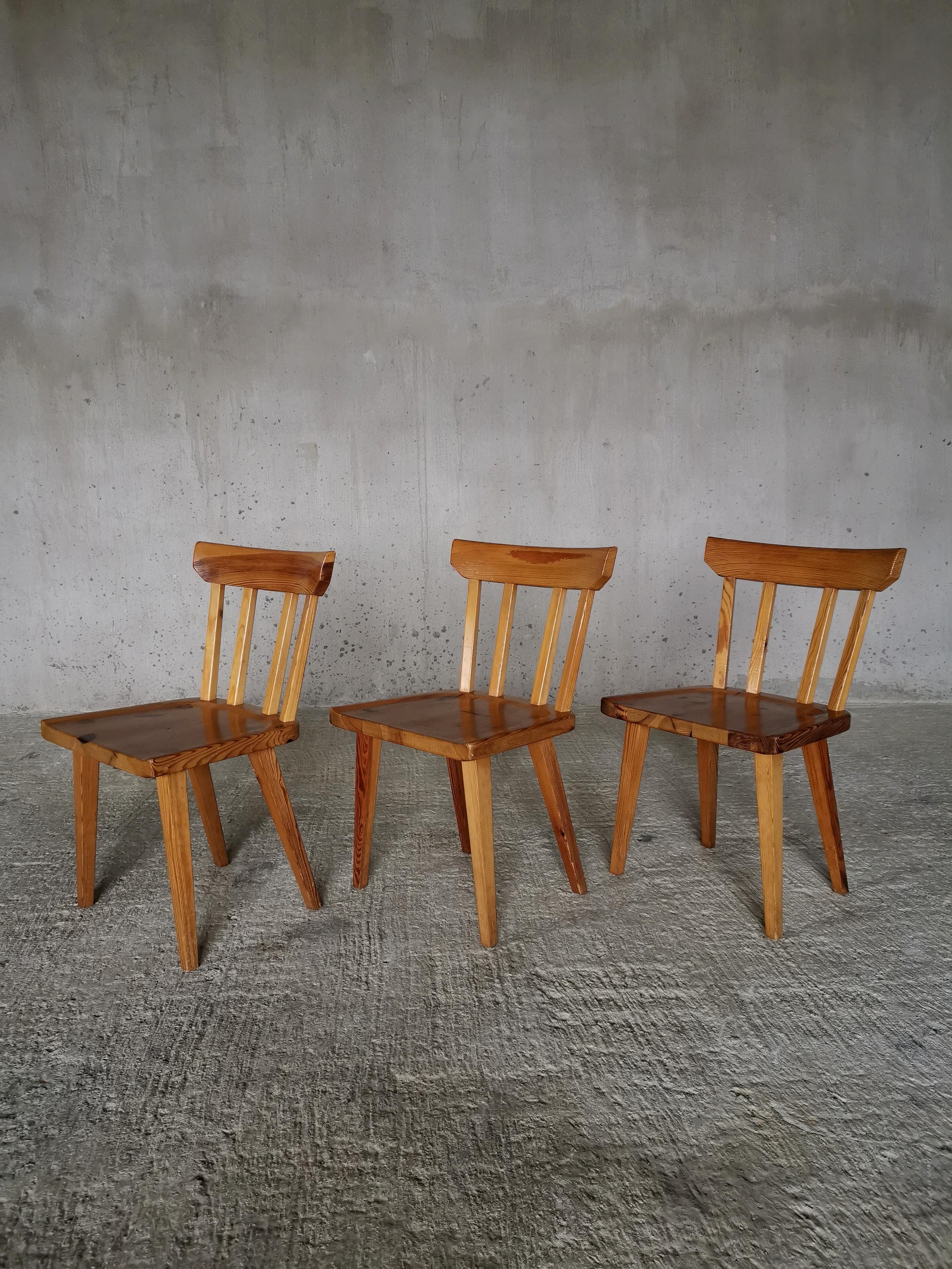 Set of three dining chairs in solid Oregon pine, design Carl Malmsten.
Produced by Karl Andersson & Söner, 
Sweden 1960s
Vintage condition, wear consistent with age and use. 
Distinctive and beautiful visible joinery work. Beautiful wood grain and