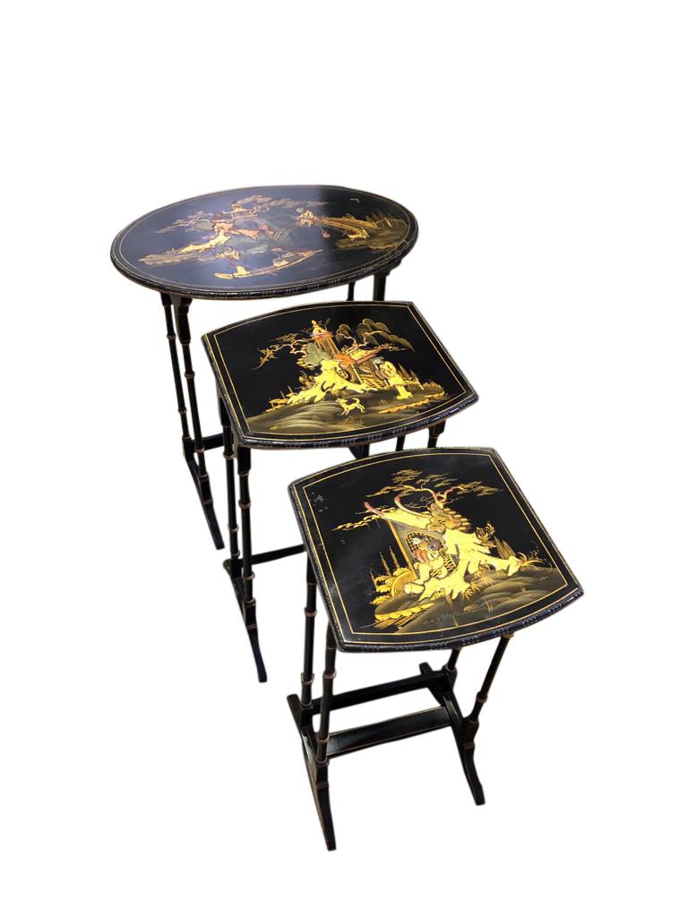 A superb set of three carved Chinese chinoiserie nested tables, 19th century. The set each have a different scene, from a Japanese wason under a bridge, to scenes of Jomon Sugi, the oldest and largest among the old-growth cryptomeria trees on the