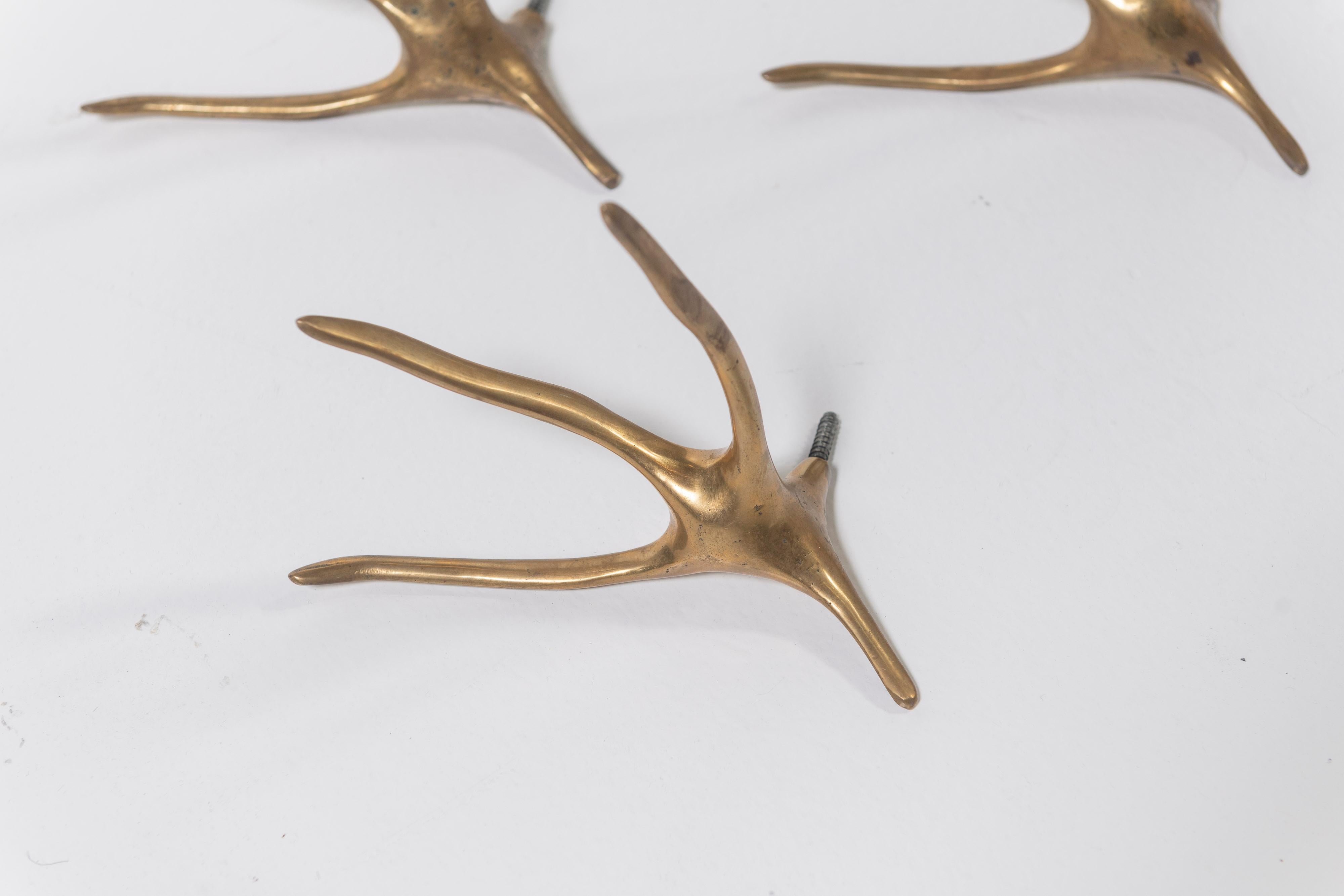 Modern Set of Three Cast Brass Wall Hangers, In the Style of Meret Oppenheim For Sale