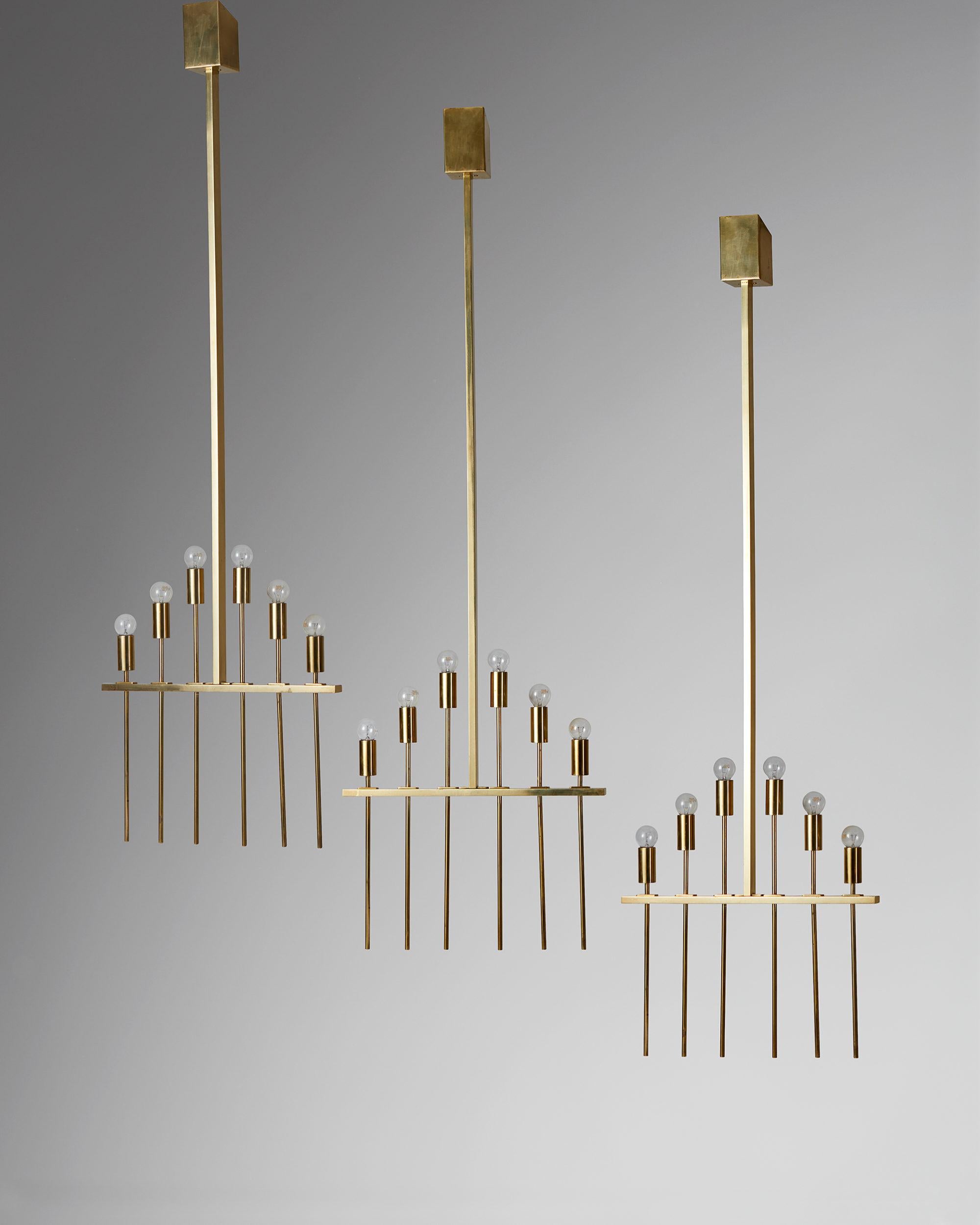 Set of three ceiling lamps/chandeliers, anonymous,
Finland. 1960´s.

Brass.

Dimensions:
H: 166 cm/ 5' 5 1/3