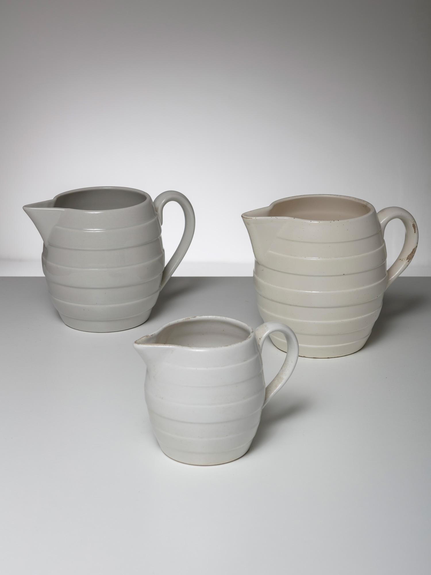 Graceful set of three pitchers by Guido Andloviz for SCI Laveno.
Each piece comes with a slight different color and surface finish.