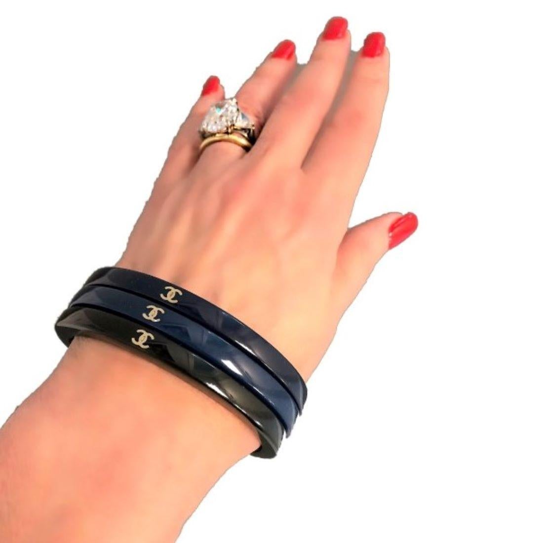 Women's Set of Three Chanel Bangles- Blue, Dark Blue and Black with Gold Tone CC Logo For Sale