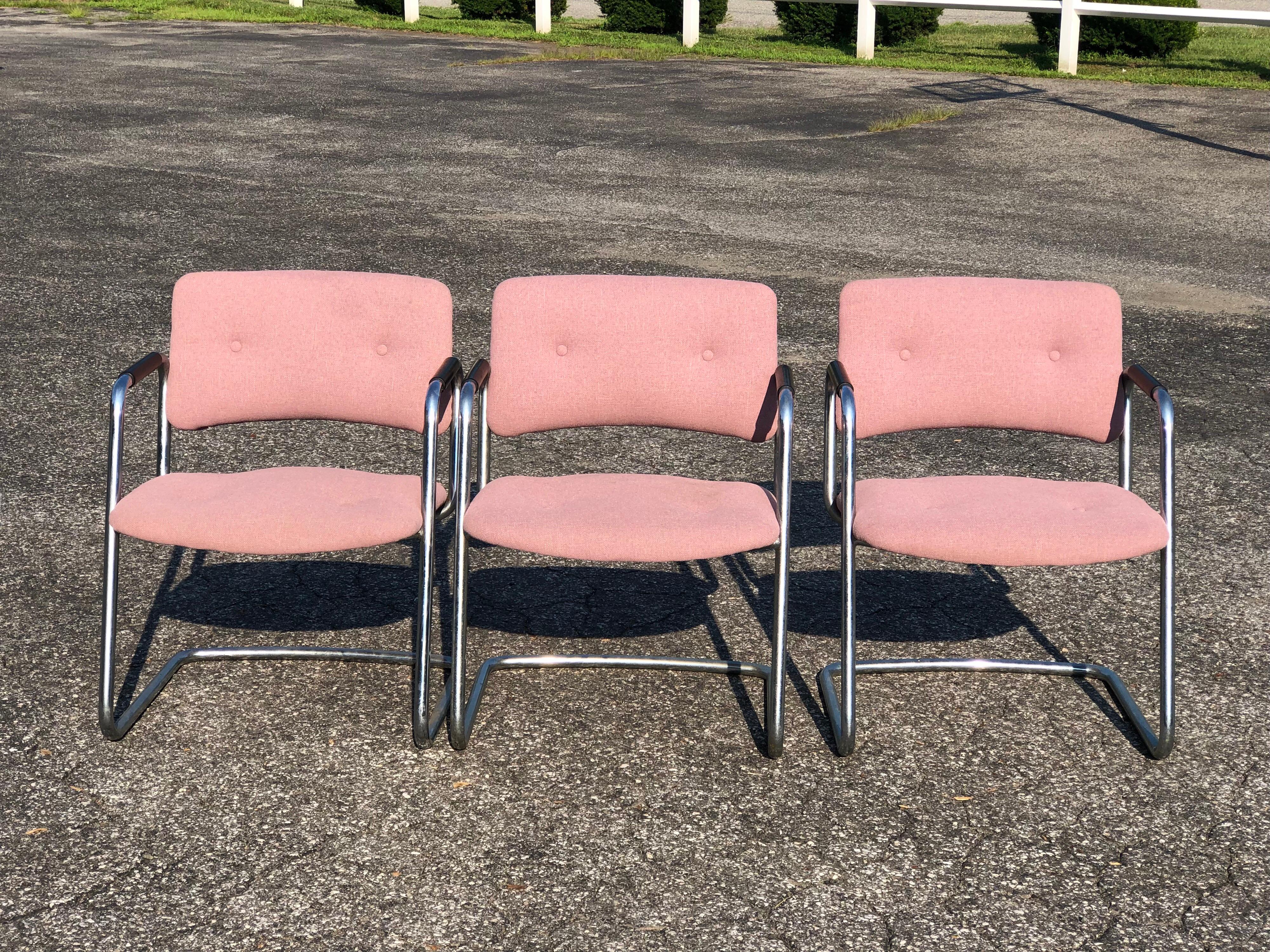 Set of three chrome steelcase chairs. In a light plum colored upholstery. Perfect for office or dining. Being sold individually. Buy one or all. Comfortable wide seat with nice cantilevered base. Durable rubbered arm rests in black make these