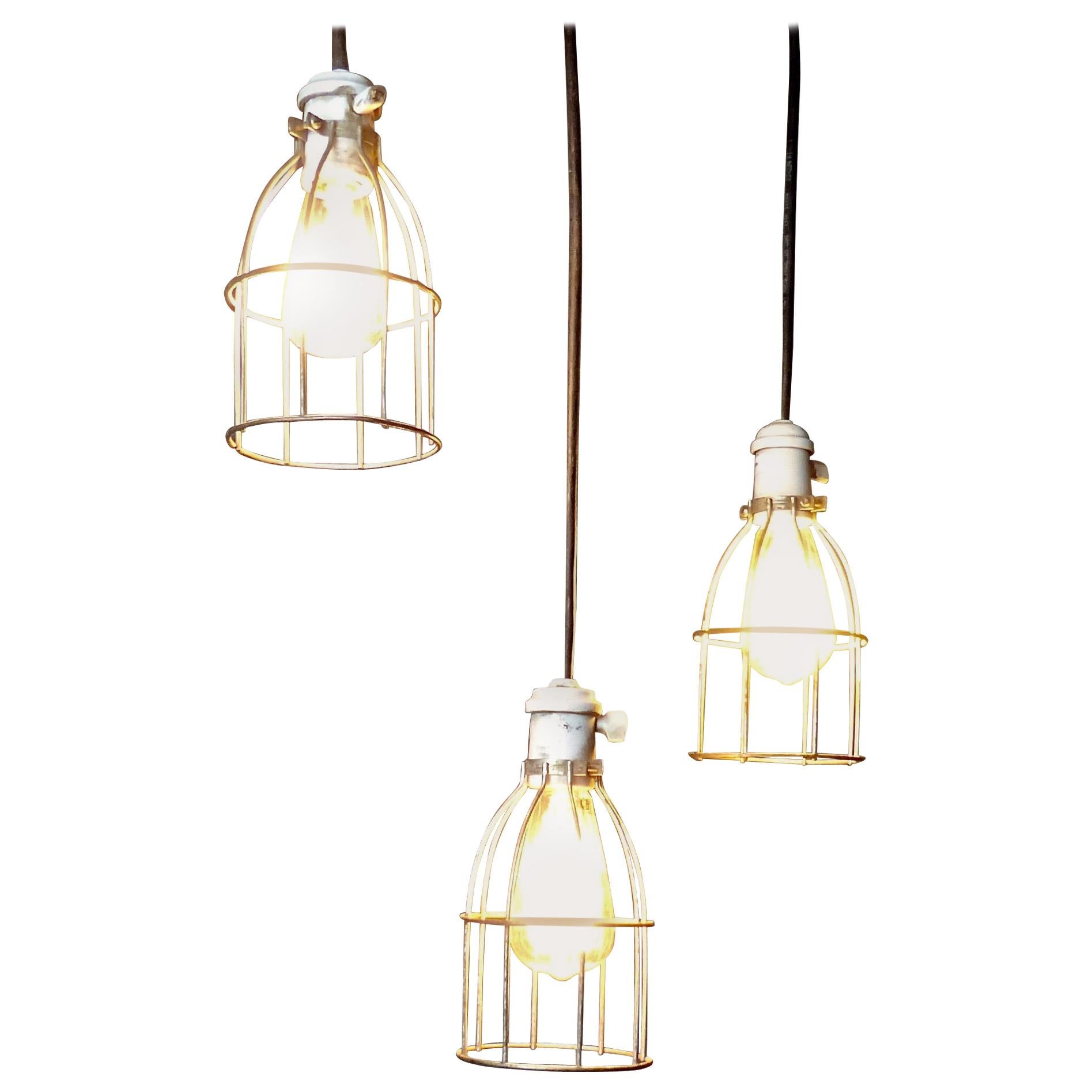 Set of Three circa 1930 Caged Industrial Lights