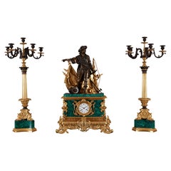 Set of three clocks and two pedestals from the 19th century.
