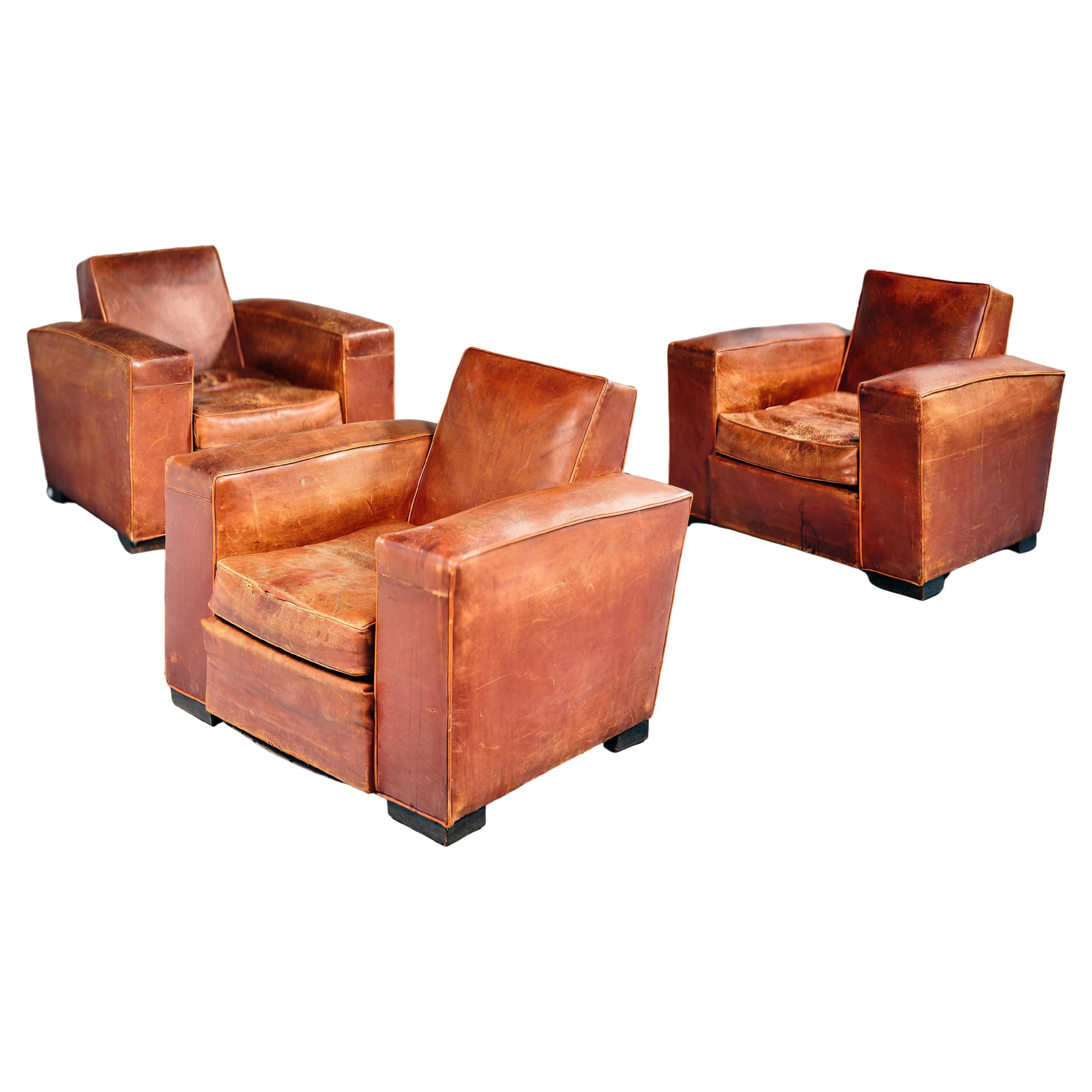 Set of three club chairs, Attribued to Jacques Adnet For Sale