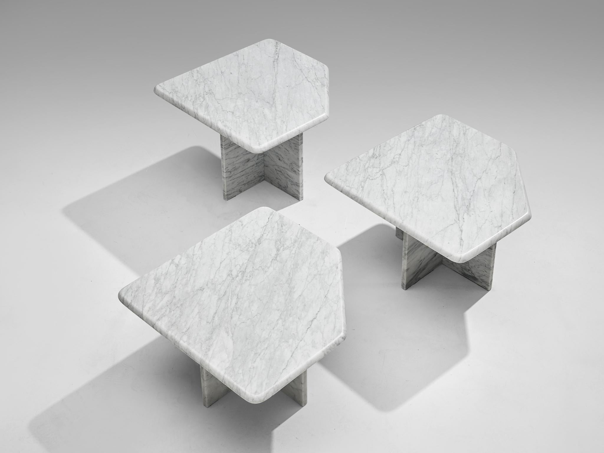 Set of three coffee tables, marble, Italy, 1970s.

This set of three geometrical marble coffee tables each feature a diamond shaped tabletop and an X-shaped base. The aesthetics are archetypical for postmodern design, bearing references to