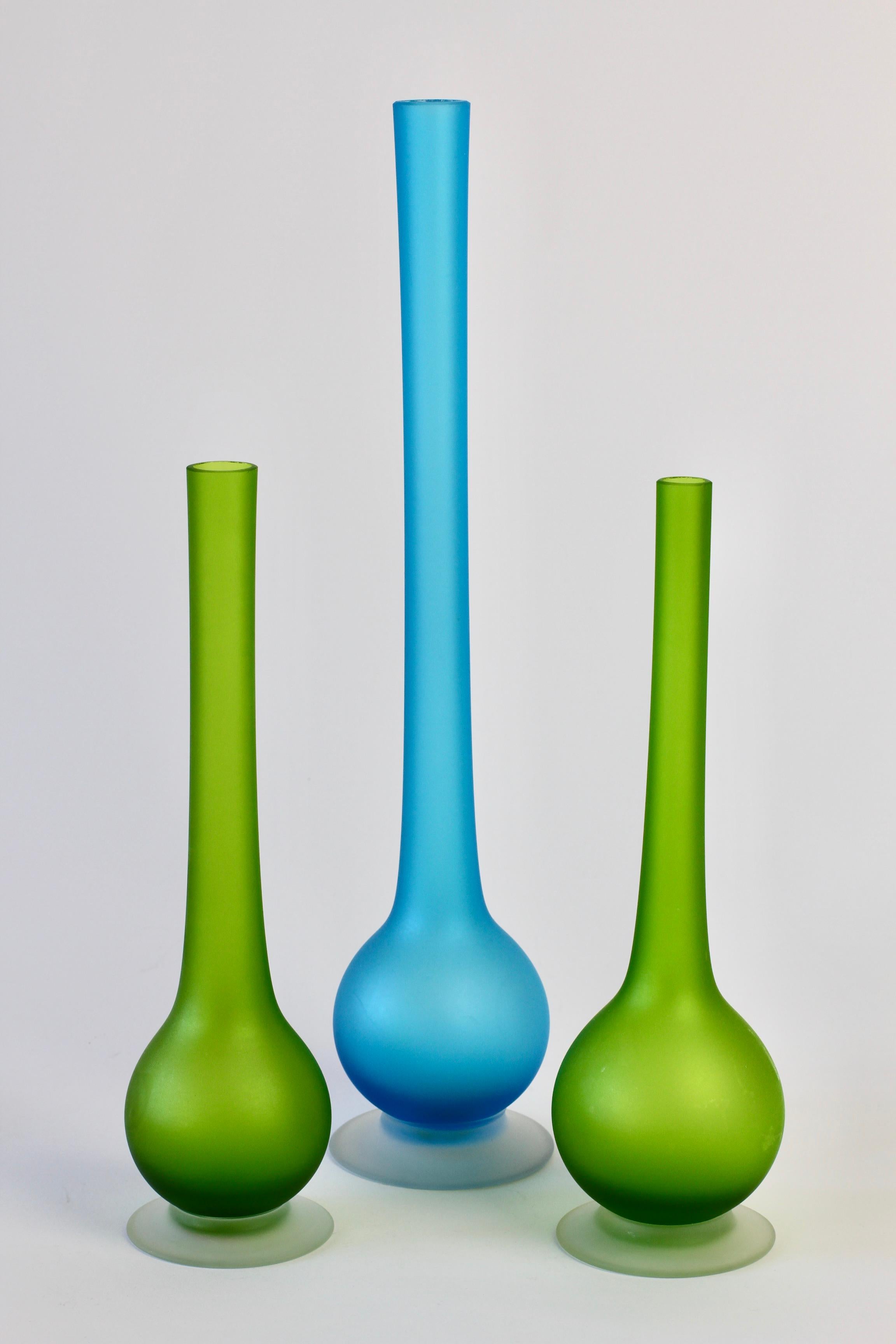 Stunning set of three Mid-Century Modern vibrant jellybean colored / colored satin Murano glass pencil neck vases by Carlo Moretti (1934-2008), circa 1970.

An absolutely bold yet elegant design with the use of bright, vivid blue and orange