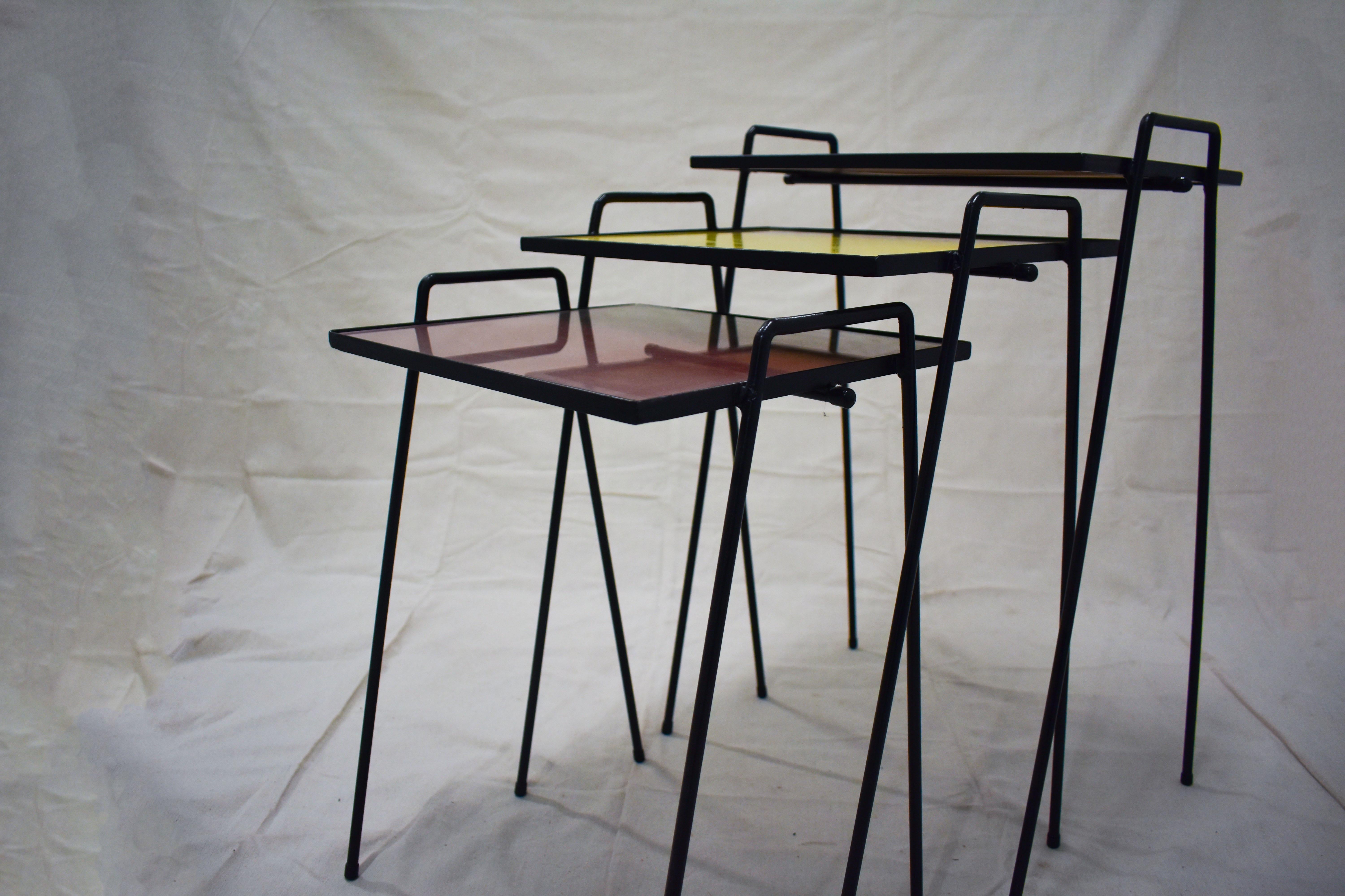 Mid-Century Modern Set of Three Colorful Mid-Century Stacking Tables with Glass Tops and Iron Legs For Sale