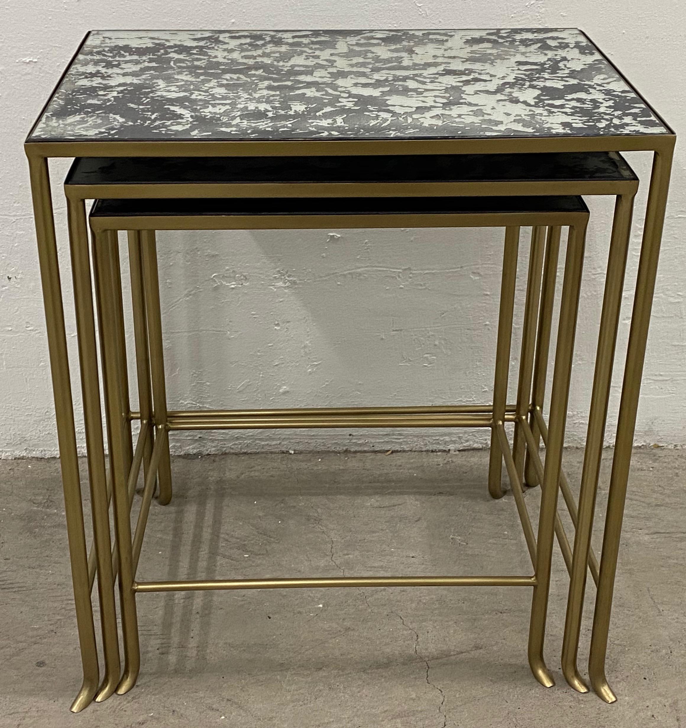 Set of three contemporary brass plate steel and flecked mirror nesting tables

These contemporary tables have a Classic mid modern touch.

The tables nest for easy storage. Pull one, or both out for an extra surface when your friends or family