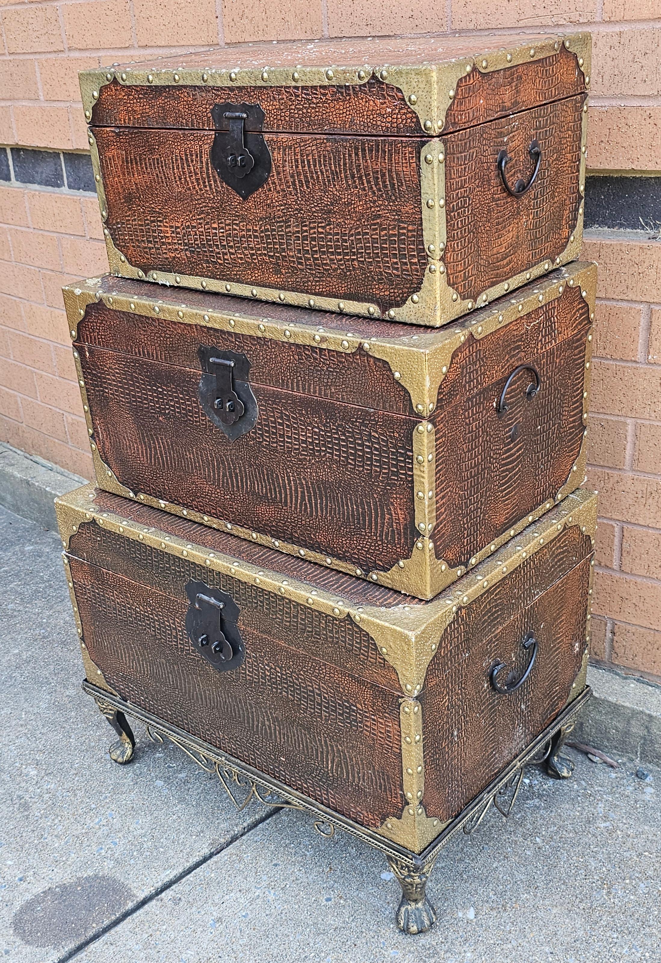 A very decorative Set of Three Contemporary Graduated Stacking Storage Chests on metal Base. Felt lined interior.
Measures respectively from the bottom, 23.5