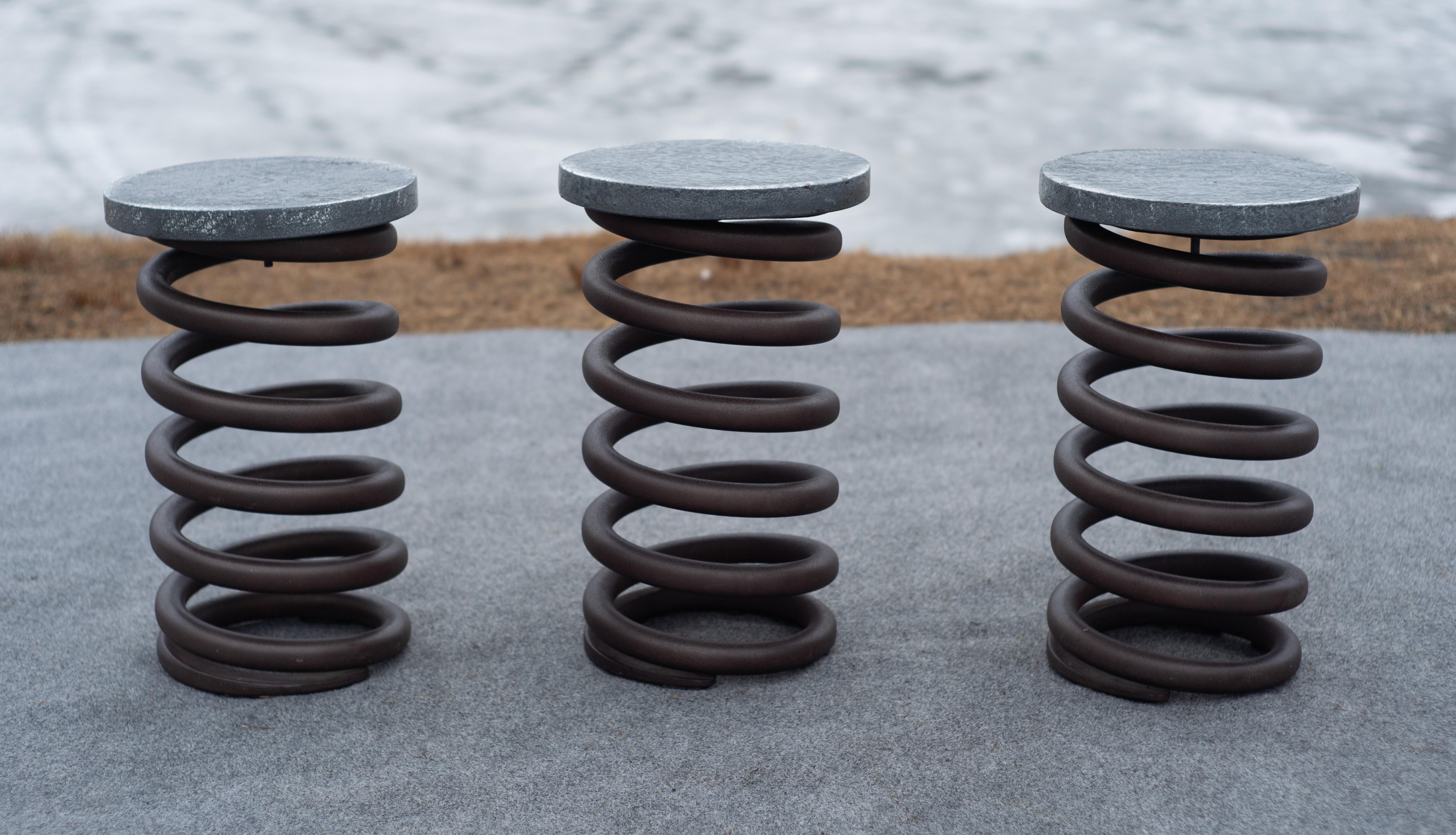 These awesome spring stools were made recently by Restoration Hardware. They feature an industrial-grade steel spring base and a solid cast iron seat. The construction leads them to be roughly 80 lbs. per stool, but extremely high quality. The look