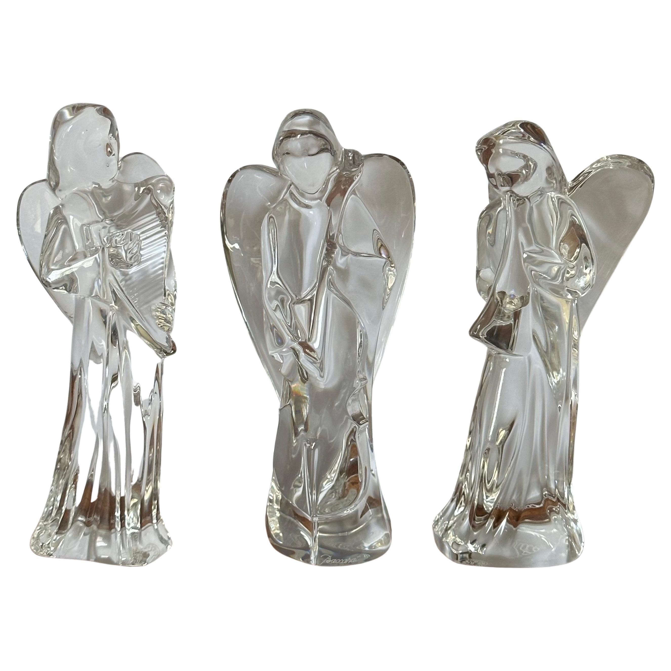 Gorgeous set of three crystal angels playing various instruments (harp, cello, horn) by Baccarat, circa 1970s. The sculptures are in very good condition and measures approximately 3