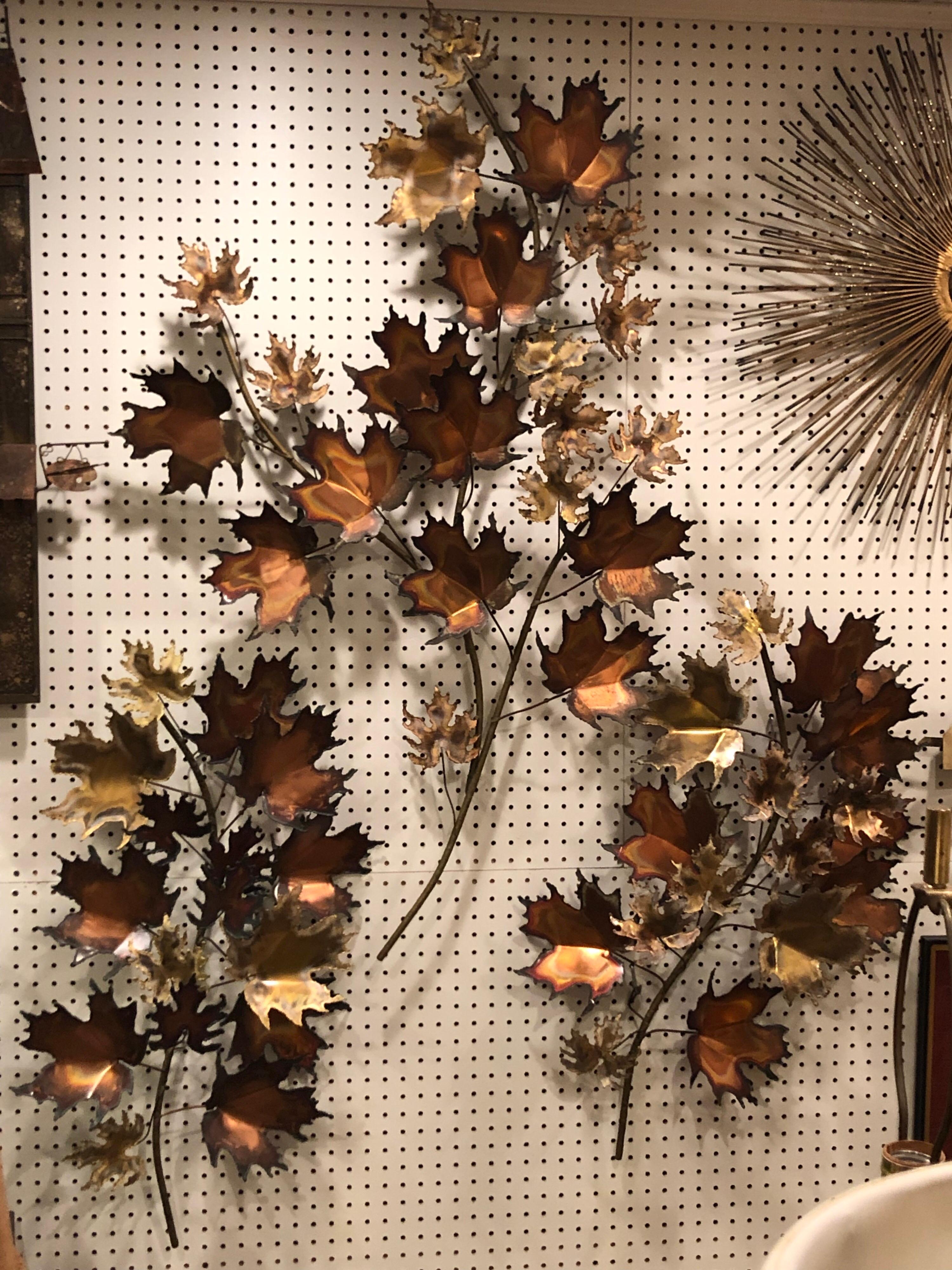 Fabulous set of three Curtis Jere Brutalist torch cut leaf wall sculptures. Two smaller leaves are signed. See photos. The group as a whole measures: 66 inches H x 4ft W x 8 inches D.