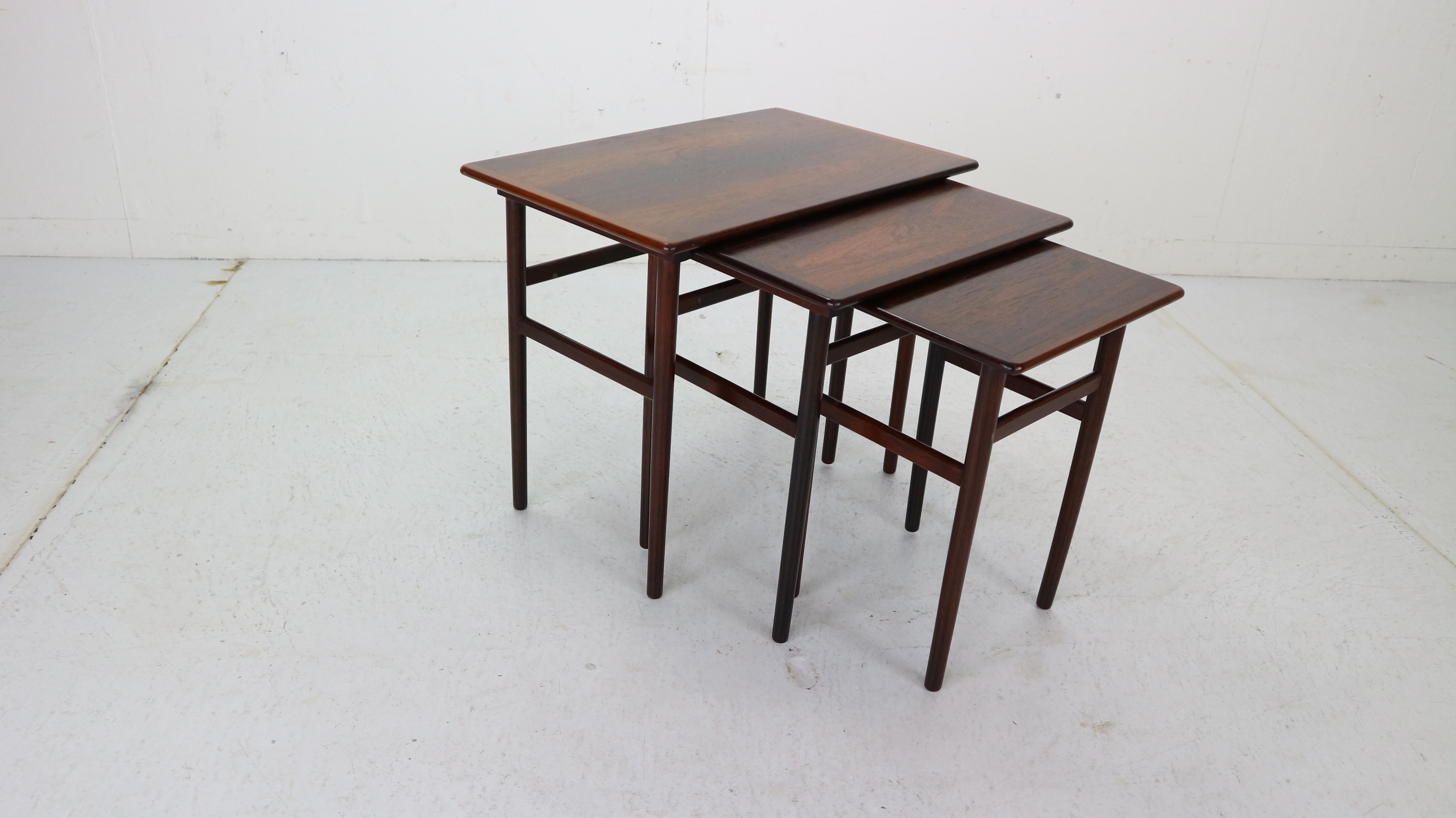 Set of 3 Danish nesting tables from the 1960s period, Denmark.
The tables are made of rosewood and can be pushed into one another on small strips of wood.
Original condition.
Measurements:
Large L 39 x W 60 x H 50cm.
Medium L 34 x W 47 x H