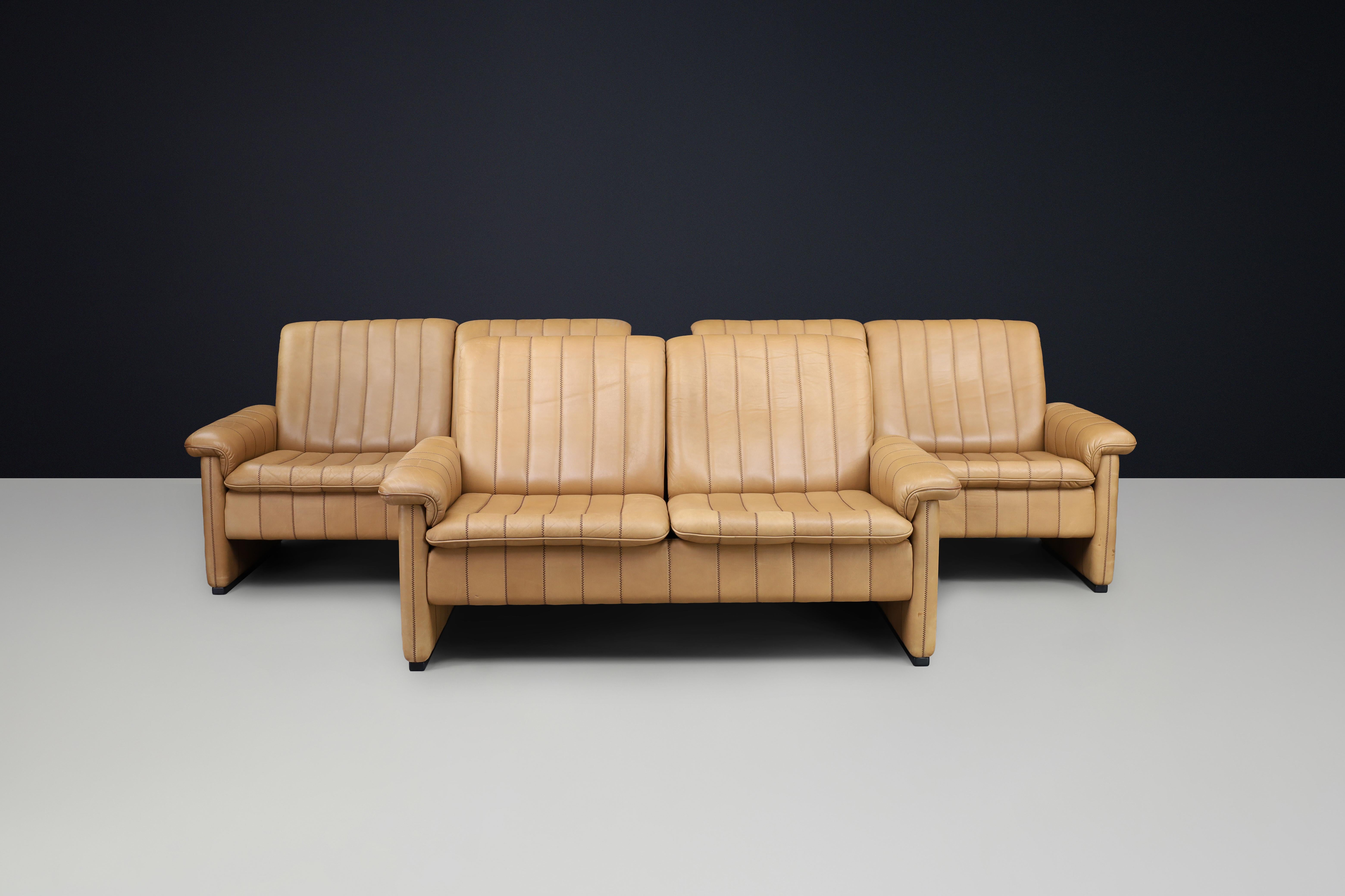Set of Three De Sede DS-83 Sofas in Tan Leather, Switzerland, 1970s

Exceptional set of three DS-83 sofas by De Sede, handcrafted in Switzerland in the 1970s. Upholstered in supple tan aniline leather with the brand’s signature channel stitching and