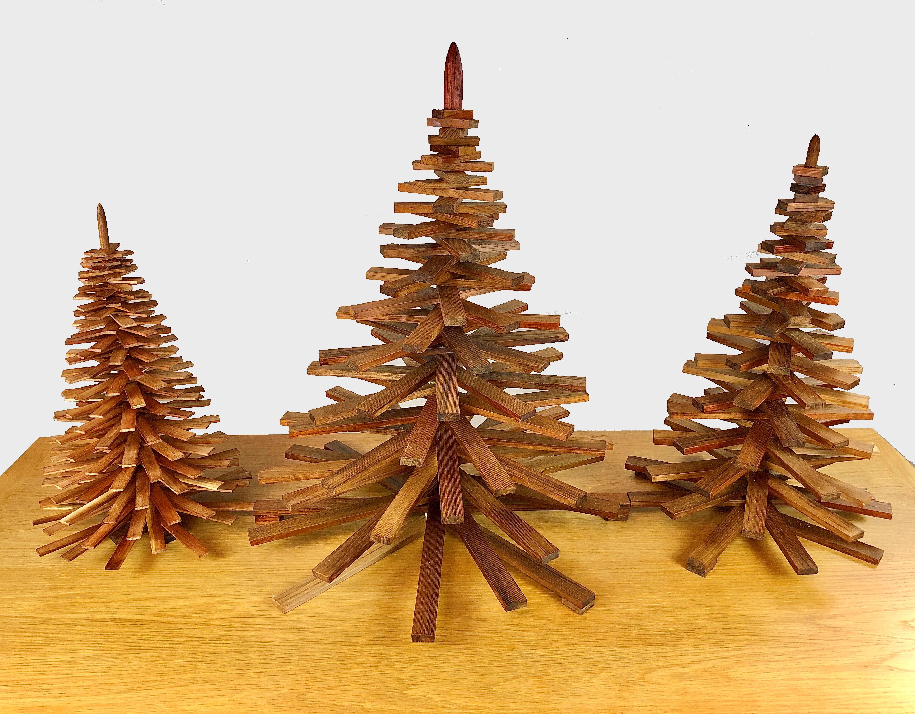 Set of three decorative handmade Christmas trees.

The Christmas trees are made of upcycled pieces of oiled teak from a furniture manufactorer that would normally be handled as waste - each Christmas tree is because of this uniqe why variation in