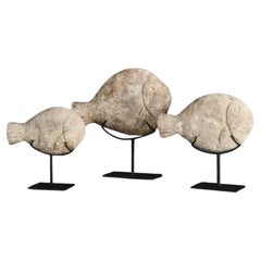 Set di tre pesci decorativi in pietra con patina naturale